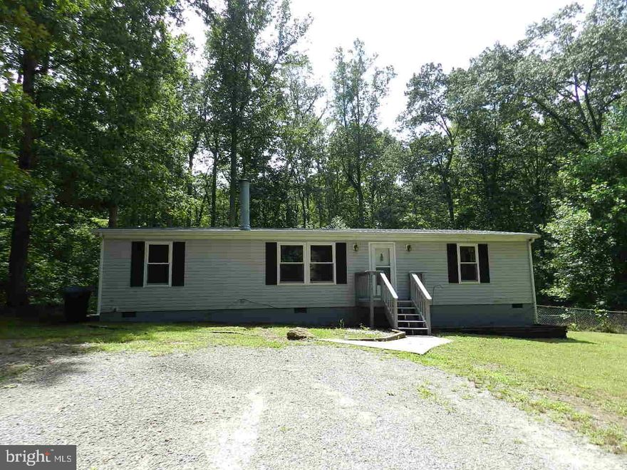 Completely remodeled! Great starter home situated on a wooded 3 acres.  All new laminate flooring and carpet through out, brand new white kitchen with granite and butcher block counter tops. New windows through out, plus a new roof and newer heat pump. Master Bathroom has a newly tiled shower, updated floors and vanity. Rear deck over looks quiet wooded back yard. Above ground pool with deck surround conveys as-is (needs new liner)  Less than 6 Miles to the Thornburg Exit!