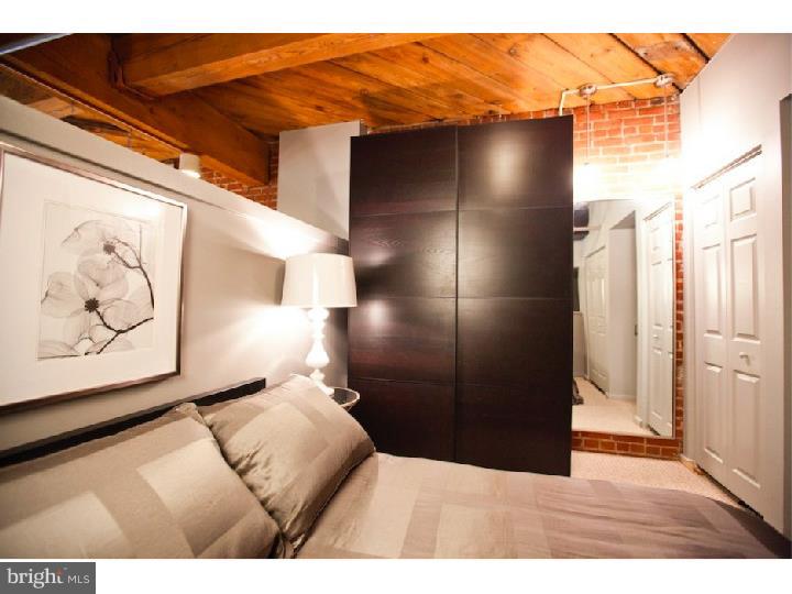 Exceptional meets affordable in this charming Old City loft that comes with a DEEDED PARKING space! The unit features loft-style bedroom, exposed brick walls & ductwork, upgraded bathroom with tile floor, glass tile shower & new vanity/sink, and WASHER/DRYER in unit. The kitchen has hardwood flooring, track lighting & the appliances are just a few years young. You'd hardly know you were in the city as you look out the window of this second floor unit, with its tree-line views overlooking the central courtyard! Unit comes with a nicely-sized storage locker located just off the elevators on 2nd floor. Priced to sell. Available immediately!