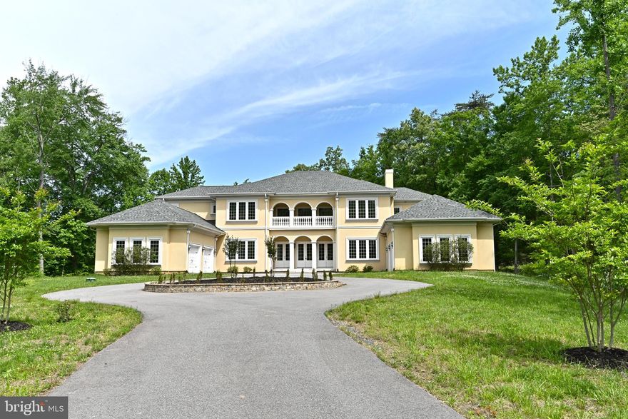 Welcome home! A perfect reflection of old world Mediterranean architecture with a modern flair. This estate rests on the eastern bank of a tributary of South Run and is surrounded by approximately 5 acres of old growth forest consisting of elm, sycamore and oak. Almost dedicated as a public park, the grounds now are an oasis of privacy with plenty of room for outdoor activities. The home is set far back from the road and backs to over 10 acres of land that cannot be built upon for a true feeling of a retreat in the woods. Boasting an all stucco exterior, circular driveway with two attached 2 car garages and an elegant front porch, this property is truly grand and inviting. As you enter through the front doors you are greeted with a marble-floored entry foyer and a hand crafted curved staircase. Formal living and dining rooms flank the foyer, and feature marble accents and dramatic 22 ft ceilings with high end finishes throughout. An open floor plan gourmet kitchen/family room is separated from the glass enclosed morning room with mosaic tile flooring. The kitchen boasts professional appliances and a 10 foot white Quartz center island and radiant marble floors keep your feet warm all winter! The breakfast area and family room open to a very private outdoor patio with tons of room for your family and friends enabling a gracious indoor-outdoor living and entertaining space. Down the hall from the kitchen there is a large pantry, main floor laundry room along with a modern powder.  A main level master bedroom is tucked into the right rear corner of the home with a spa master bath with tile flooring, 2 Rain Shower systems,  large soaking tub, bidet and push button commode. Make this your private retreat after a long day of entertaining family and friends! This home offers multiple office space options. His walk-in closet includes custom shelving while her 18x12 custom closet includes custom shelving for shoes, hats, handbags and all of your finest clothes. Soaring 12 foot ceilings, 8 foot interior doors, Carrier and Bryant dual-zone HVAC systems, new paint, fully finished 4th floor loft included. Brand new, top of the line LG washer and dryer installed 5/22/23.  This is the most unique and private property in the area so do not wait, this opportunity will not last long!!