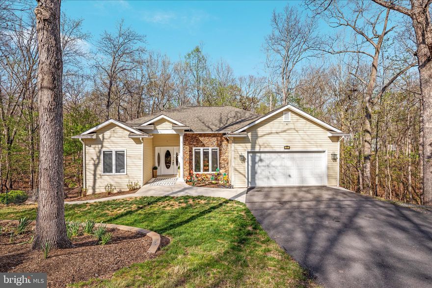 Welcome to Lake Holiday—just in time for summer fun on a beautiful 240-acre lake! This exceptional home offers the perfect blend of comfort, space, and versatility with two living areas in one.

The main level features 3 bedrooms and 2 full baths, including a spacious primary suite with a beautifully renovated bath showcasing a walk-in shower and stylish tile flooring. The open-concept kitchen is designed for gathering, complete with granite countertops, stainless steel appliances, and a large island with seating that flows seamlessly into the inviting family room with a cozy gas fireplace.

Step outside to a truly special feature—a huge screened-in porch that feels like your own private treehouse retreat—perfect for relaxing or entertaining.

The lower level lives like its own home, offering a bedroom, full bath, kitchenette, family room, private deck, and its own laundry—ideal for multigenerational living, guests, or even rental income potential.

There is also another whole "sub basement" that is perfect for more storage - this home has it all!

This is more than a home—it’s a lifestyle. Come enjoy everything Lake Holiday has to offer!