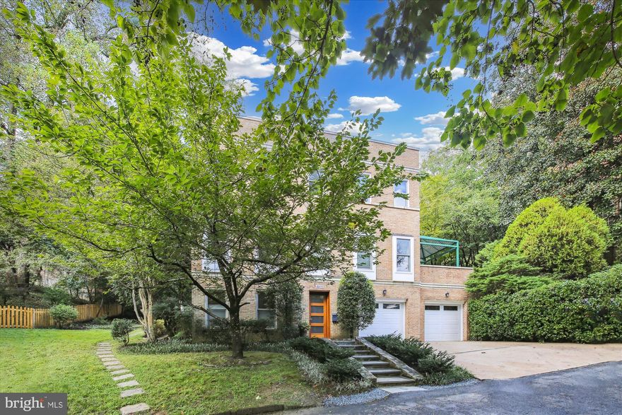 Adjacent to one of the country’s best urban parks - this is where residential tranquility and urban access meet. On a private street, mere steps to Rock Creek Park’s numerous walking, biking, and hiking trails, this stunning home offers the best of city living while also providing a sense of serenity and exclusivity. Around the corner from Hillwood Estate, Lenore Pool and Tennis Club, and a short walk to Pierce Mill, this spacious and beautiful home has a wonderful flow and a floorplan flexible enough for every lifestyle – oversized rooms for entertaining, work-from-home spaces, outdoor living space, and private guest accommodations. The main level features a generous living room with woodburning fireplace and garden access; dining room that can easily accommodate large formal dinners; renovated eat-in kitchen; library with custom built-ins; windows galore. Upstairs is a sumptuous primary bedroom with sitting area and fireplace, spa-like primary bathroom, two additional bedrooms and bathroom.  A skylight streams light to all levels, including the entry level where you’ll find a large family room with fireplace, an in-law suite, laundry room, plenty of storage, and a 2-car garage. New roof, new skylight, numerous other updates. Surrounded by lush greenery, the terraced lot provides complete privacy. Guest passes to Hillwood Estate included!