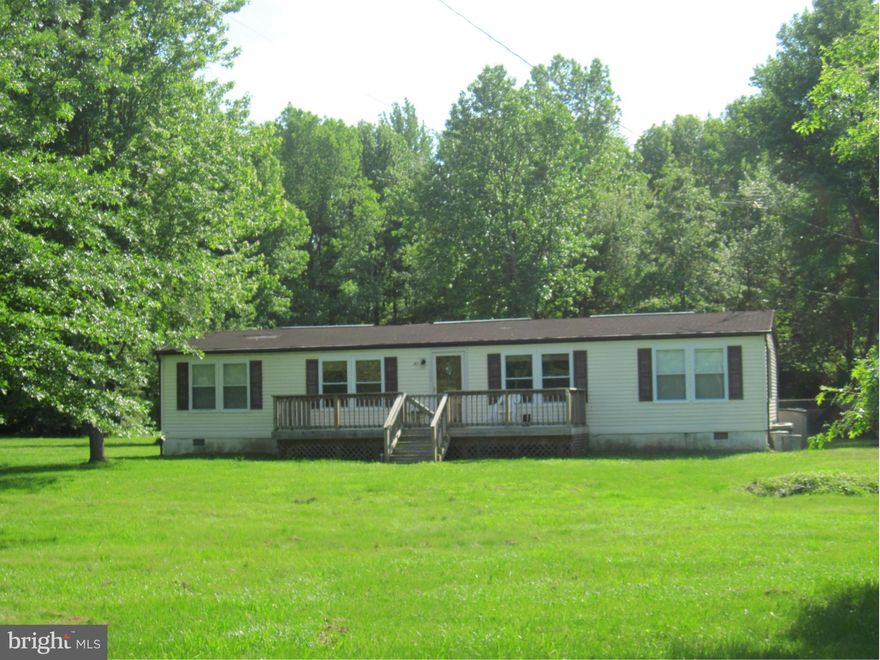 Enjoy year round living in this well maintained ranch on 3 wooded acres.  The seller has added a family/sun room and deck, master bath has been completely redone with handicap accessible tub and shower, a wood stove in the living room will help keep the chill away in the winter time.  It has a newer well and a large block building with fireplace for any hobby or auto enthusiast.