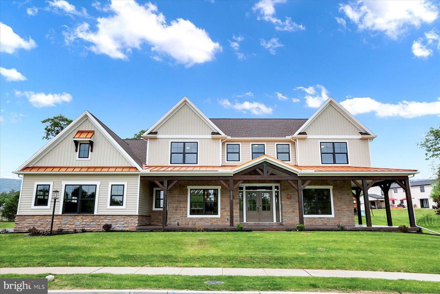 Welcome to the Quinn! Touting more than 3,600 sq. feet of living space with a large wrap-around front porch of this Farmhouse design. Enter into the grand foyer with a herringbone laid brick floor, flanked on one side by a large den and the other side with a dining room built to entertain gatherings of 12 or more! Flow from the foyer into the luxurious eat-in kitchen with an island that is over 8 feet long! The kitchen boasts a double wall oven, wine fridge, dishwasher, microwave cooktop, pot filler, hot shot, and range hood vented to the exterior just to name a few! The expansive family room features a beautiful gas fireplace as well as a door to the wrap-around porch! The staircase for the second-floor access has a bookcase and bench seat underneath it. Elegant finishes, trim detail, coffered and tray ceilings, a walk-in pantry, 3-car side entry garage are but a few more of the first-floor features. The second floor boasts an Owner’s Suite as well as 3 additional, large bedrooms all with walk-in closets and one with a private bathroom! The Owner's Suite is set away creating its own private retreat with features to please the most discerning palate!  Upon entering the room, you are greeted with a shiplap on the main wall as well as a tray ceiling. The owner’s bathroom includes a heated ceramic tile floor, a walk-in shower with multiple shower heads & body jets, a free-standing copper soaking tub, and a walk-in closet with plenty of storage room to name a few. Finished basement to give you an additional 1000 square feet of living space.  Don't miss your chance on this one!