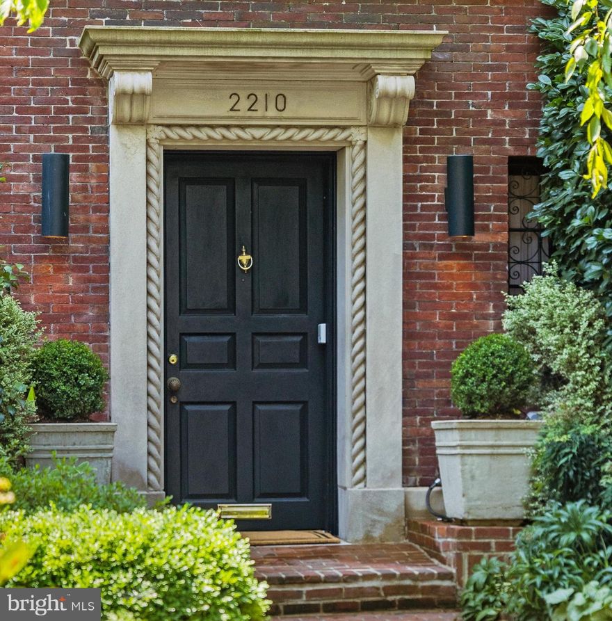 Stately brick townhome on a quiet, tree-lined street in the coveted Kalorama neighborhood of Washington. This exceptional residence showcases grand proportions, soaring ceilings, elegant architectural details, and multiple fireplaces that reflect timeless craftsmanship. Designed for both formal entertaining and comfortable daily living, the multi-level layout offers expansive living and dining spaces, refined bedroom suites, and flexible rooms ideal for a library, office, or guest quarters. A private courtyard provides a serene outdoor retreat, while the rare detached two-car garage adds everyday convenience. Ideally located near acclaimed dining, Rock Creek Park, and key commuter routes, offering effortless access to Downtown, Dupont Circle, and surrounding neighborhoods.