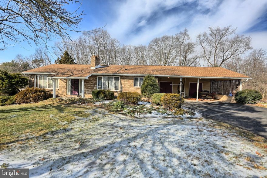 Welcome to this 3-4 bedroom Ranch that borders woods and offering stunning mountain, country side views. Home boasts two beautiful stone hearths with propane stoves providing great supplement heat source. New central AC, spacious living room with bay window views. Kitchen/Dining area with bay window. 1st floor baths with updated laundry area. Lower level family room accented by stone hearth/gas stove with a second laundry area. Newer roof, treck deck, and more. Two car carport with extra large storage area and back yard shed.