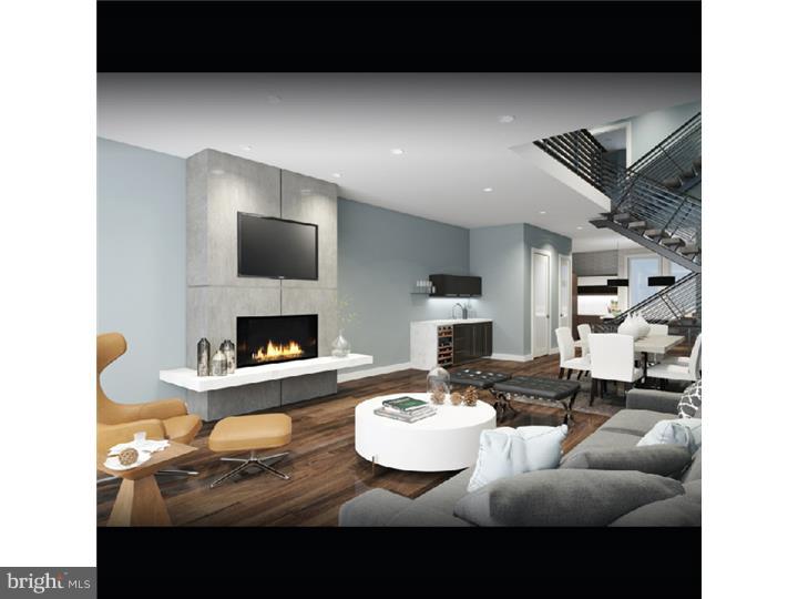 Discover the perfect blend of luxury, style and comfort at the Walnut Estates. Scheduled for completion in mid 2016 and one of 5 in a gated community, this 19' wide, 5,000 square foot home with 2 car garage features 4 light filled bedrooms, 4 full bathrooms, 2 half bathrooms and includes a variety of luxury finishes such as hardwood flooring, built in speakers, solid core interior doors, video intercom system, home automation system, elevator and dual zoned HVAC system. The home showcases comfort & style from start to finish, starting with its tiled foyer and spacious first floor bedroom, up to the second floor which features a gorgeous dining room with ceilings that soar over 20' high, just the spot to sit down for a meal with family and friends. The dining room leads into the spacious living room with 10' high ceilings, built in speakers, wet bar, a gas fireplace and large windows leading out to a rear deck. Continue past the conveniently located powder room into the modern, stylish kitchen with all the bells and whistles you could ask for, such as top of the line stainless steel appliances, custom cabinetry with under cabinet lighting and gorgeous quartz or granite counters with a large island. Upstairs, the 2 bedrooms, laundry room, family room and tiled hall bath on the 3rd floor are a treat, but the 4th floor master suite is a work of art with its huge walk in closets, large deck, and master bath with radiant heated floors, private toilet room and custom tiled shower with dual shower heads, raincan ceiling and handheld showerheads, all within a frameless glass enclosure. From the master suite be sure to head up to the pilot house with sitting area and optional wet bar, and onto the spacious roof deck which offers stunning views of the city. The full finished basement completes this stunning home, which includes a fantastic media room with ceilings over 9' high, wall to wall carpeting, conveniently located powder room and optional wine cellar. Located in the highly desirable Rittenhouse Square area, the home has a 10 year tax abatement pending.