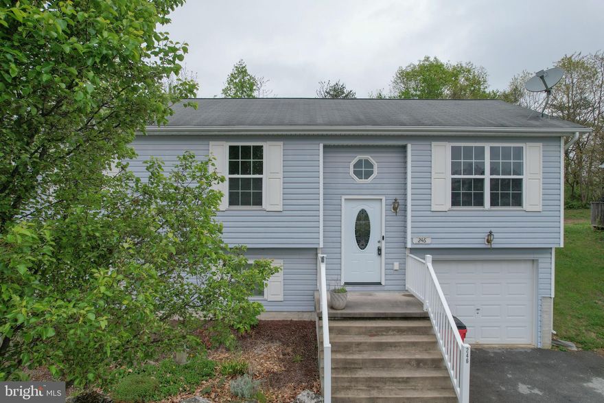 Tucked quietly in the heart of South Berkeley County, this well-maintained split foyer at 246 Freight Car Circle offers the kind of comfort, convenience, and value that buyers are actively searching for right now. Positioned just off the main thoroughfares—yet moments to key commuter routes—this home strikes that sweet spot between accessibility and peaceful neighborhood living.

Step inside to find low-maintenance laminate and luxury vinyl plank flooring flowing throughout, making everyday living both practical and polished. The upper level welcomes you with a spacious kitchen featuring a breakfast bar, newer appliances, and a dedicated dining area that opens through French doors to a rear wooden deck—perfect for morning coffee or unwinding at the end of the day.

Downstairs, the lower level offers flexibility that today’s buyers crave. With brand new flooring, a full bathroom complete with a walk-in shower, and a separate exterior entrance, this space lends itself beautifully to guests, a home office, or additional living quarters. The oversized laundry and utility room is thoughtfully tucked away, yet offers ample room for storage and function—because real life needs real space.

Outside, the yard is well cared for and easy to maintain, and the small neighborhood setting includes a road maintenance agreement that helps preserve the community feel without the weight of a large HOA.

Whether you're a first-time buyer, downsizing, or simply looking for a smart investment in a desirable location, this home checks the boxes. Affordability meets opportunity here, especially with a variety of West Virginia homeownership programs and incentives that may be available to qualified buyers—making homeownership more attainable than you might think.

If you’ve been waiting for the right combination of location, layout, and value… this is it. Schedule your private tour today and see how easily this home could fit your next chapter