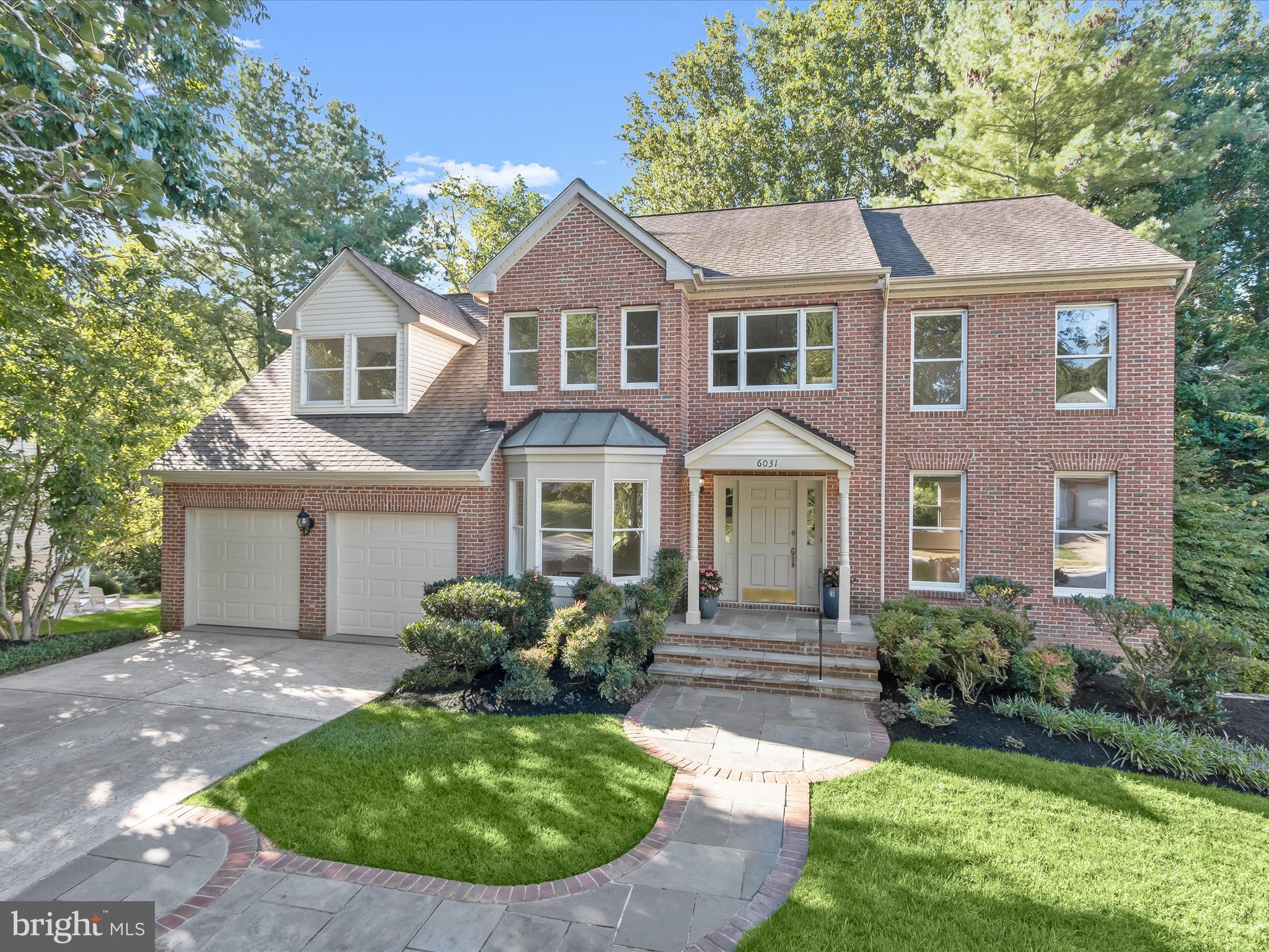 Set on a spacious wooded lot along a quiet no-through street, this beautiful brick front home in sought-after River Hill combines timeless curb appeal with thoughtful updates and abundant living space. A stone walkway with brick edging, complemented by well-tended landscaping, sets the stage before you step inside. The two-story foyer makes a striking first impression with its clerestory window, freshly painted interiors, and gleaming hardwood flooring that extends throughout much of the home. To the left, a private home office with a bump-out window and double door entry offers an ideal retreat for work or study. To the right, the formal living room flows gracefully into the dining room, where crown molding and chair railing add an elegant touch for gatherings both large and small. At the heart of the home, the renovated kitchen showcases high-end cabinetry with thoughtful built-in storage features, including roll-out shelves and a spice rack, paired with granite countertops and a stylish stone backsplash. Stainless steel appliances, including a new gas cooktop and wall ovens, meet every culinary need, while the pantry with additional roll-out shelving enhances functionality. The adjoining breakfast area opens to the deck, making indoor-outdoor dining effortless. Just beyond, the family room impresses with its cathedral ceiling and wood-burning fireplace, creating a warm and inviting place to relax. A renovated powder room, laundry room with cabinetry and sink, and access to the two-car garage, where the garage door was replaced in 2018, complete the main level. Upstairs, the expansive primary suite includes a step-up sitting room, a walk-in closet, and a spa-like bath featuring a double vanity, soaking tub, and tiled shower. Three additional bedrooms with gleaming hardwood flooring share a full bath with a double vanity, providing both comfort and style. The unfinished lower level offers exceptional versatility, with space for recreation, exercise, storage, or the potential for future finishing. A sliding glass door provides a walkout to the backyard, connecting the indoors with the tranquil outdoor setting. A spacious composite deck with stairs overlooks the fenced backyard that backs to trees, offering privacy and room to entertain. With over 4,500 square feet throughout the home and two beautifully finished levels, this residence combines scale and sophistication in equal measure. Beyond the property itself, River Hill in Clarksville enriches daily living with a vibrant mix of conveniences and recreation. The River Hill Village Center provides shops, dining, and services within minutes, while the River Hill Pool, scenic walking trails, and the nearby Middle Patuxent Environmental Area offer endless opportunities for outdoor enjoyment. Highly rated schools and a calendar of community events further enhance the neighborhood’s welcoming atmosphere. This River Hill gem offers not only a stunning home but also a lifestyle filled with comfort, convenience, and connection. Please note: photos depicting furniture have utilized virtual staging.