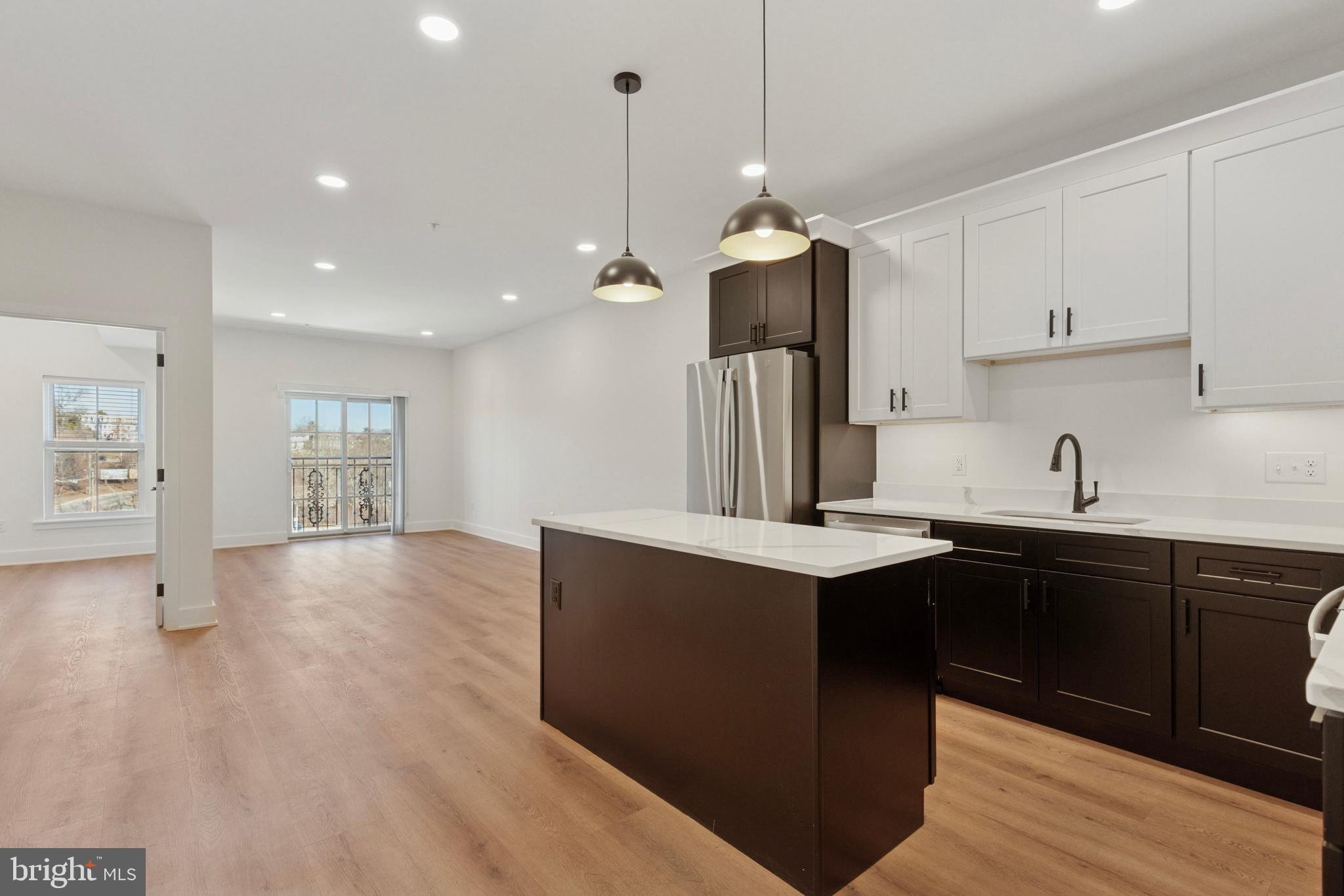Discover Bridge & Main Lofts – Phoenixville's Premier Boutique Apartments
12 exclusive residences blending style, comfort and convenience in the heart of downtown Phoenixville!
These beautifully crafted 1-bedroom apartments blend classic character with modern design, offering spacious, open layouts perfect for today’s lifestyle. Each home features a sleek kitchen with stainless steel appliances, quartz countertops and quality cabinetry, washer and dryer, expansive windows that invite abundant natural light and warm finishes that create an inviting atmosphere.
Apartment 12 is a bright and open layout featuring a large kitchen and is the only unit with a kitchen island! The sliding door in the living room adds to the open feel and provides sweeping views.
Located in the center of Phoenixville’s vibrant dining, shopping, and entertainment scene, Bridge & Main Lofts offer the charm of historic surroundings with the convenience and comfort of new construction. With easy access to the Schuylkill River Trail and major highways, you’re connected to everything this dynamic area has to offer. Embrace a unique blend of classic appeal and modern living—your new home awaits!
Enjoy Peace and Quiet, Even in the Heart of the Action!
We understand that living above a bar and restaurant might make you wonder about noise levels. That’s why we went above and beyond during construction to create a peaceful and serene living experience:
* Superior Soundproofing: Poured Gypcrete floors provide an extra layer of noise reduction.
* Enhanced Insulation: Every wall is equipped with sound batt insulation, and the spaces between ceilings and floors are fully insulated for maximum soundproofing.
* Thicker Drywall: We used 5/8" drywall on all walls and ceilings, reducing sound transfer and ensuring a quiet environment.
With these state-of-the-art construction features, you can enjoy the energy of the neighborhood when you want it—and the tranquility of your home when you don’t.