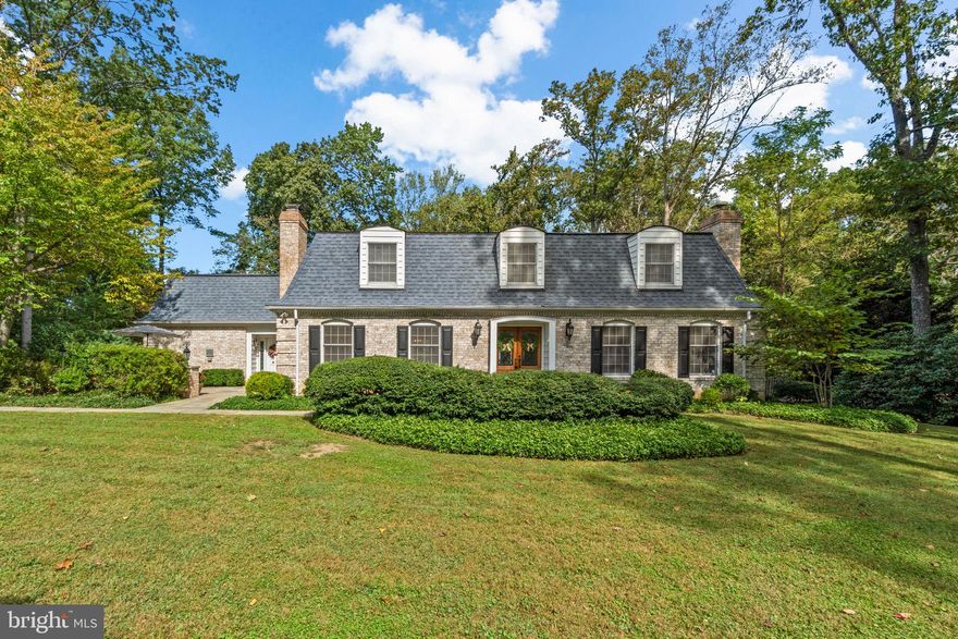 BUYERS FINANCING FELL THROUGH! This is a rare opportunity to own a timeless Dutch Colonial in the prestigious Woodmark community. Exquisite and elegant, this four-bedroom home combines classic architecture with modern comfort, offering exceptional space both inside and out. Set on one of the best lots in Woodmark, the property sits gracefully on a flat, beautifully landscaped parcel with an exquisite driveway leading up to the home. The setting provides a sense of privacy and distinction, with neighboring homes positioned well off the road to enhance the community’s refined appeal.
Inside, the home features rich hardwood floors and a stunning eat-in kitchen with high-end stainless-steel appliances, including a gas range and double wall ovens. The kitchen opens to the back patio and heated in-ground pool, creating an ideal flow for entertaining or quiet relaxation. The spacious dining room with crown molding and a large bay window offers the perfect setting for formal gatherings, while the inviting family room centers around a striking stone fireplace that adds warmth and charm.
A main-level home office with French doors and a second fireplace provides flexibility and character. The thoughtful main-level layout also includes a convenient mudroom, a half bath, and a large laundry room that can double as a home gym. The main-level owner’s suite offers privacy and comfort with an ensuite bath. Upstairs, three additional bedrooms provide generous closet space, and a second owner’s suite features a dressing room and a luxurious bath with a double-sink vanity, soaking tub, and separate shower. A full hall bath with a double-sink vanity completes the upper level.
The fully finished lower level beautifully complements the home’s timeless Dutch Colonial character while introducing a fresh, contemporary design that feels both updated and cohesive with the home’s original craftsmanship. This expansive space is thoughtfully designed for comfort, recreation, and entertaining. The lower level includes a stylish full bath, a private second office or flex room, and a designated workout area for fitness or yoga. A spacious recreation and media room offers the perfect setting for movie nights, watching the big game, or casual gatherings with family and friends.
The solid Dutch Colonial construction, combined with the home’s inviting flow and timeless design, makes this property truly special. Experience elegance, craftsmanship, and comfort in one of Ellicott City’s most desirable communities. This remarkable home is a rare offering in Woodmark and a perfect blend of tradition and modern luxury. Mortgage savings may be available for buyers of this listing.