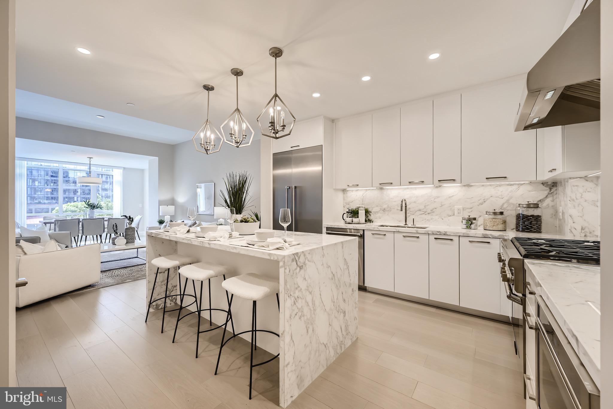 Presenting this exceptional one bedroom one bath residence located in Liberty Harbor East. Boasting nearly 1,000 square feet of living space, this impeccable newly built condominium offers an open floor plan with floor-to-ceiling windows, 9 foot ceilings and gorgeous wide plank oak hardwood flooring throughout. The refined chefs kitchen features a marble center waterfall island, full height marble backsplash, custom cabinetry that seamlessly integrates a full Thermador appliance suite including gas cooking. The spacious primary bedroom features a walk-in closet, with incredible natural light, water views, and luxurious primary bath outfitted with Kallista & Kohler fixtures, Carrara marble floors and walls, expansive shower and custom designed marble dual vanity. Liberty Harbor East is Baltimores newest luxury waterfront address. The boutique condominium offering 33 residences with stunning waterfront architecture, designer finishes, and an enviable Harbor East location atop a brand new flagship Whole Foods Market create the opportunity for the ultimate downtown lifestyle. Liberty is located in the heart of Harbor East surrounded by best-in-class dining, shopping and conveniences of downtown living. Residents enjoy a private residential concierge level with social lounge, automated and secured package room and ButterflyMX intercom security system. Residents will also enjoy access to over 30,000 square feet of private, state-of-the-art indoor and outdoor amenity spaces including a clubroom with indoor/outdoor bar, rooftop infinity pool deck with cabanas, courtyard seating, grilling stations, communal and private dining rooms with catering kitchen, fitness center, yoga studio, Pet park with dog agility and training equipment, conference rooms, study lounge with computer stations and fireplace.