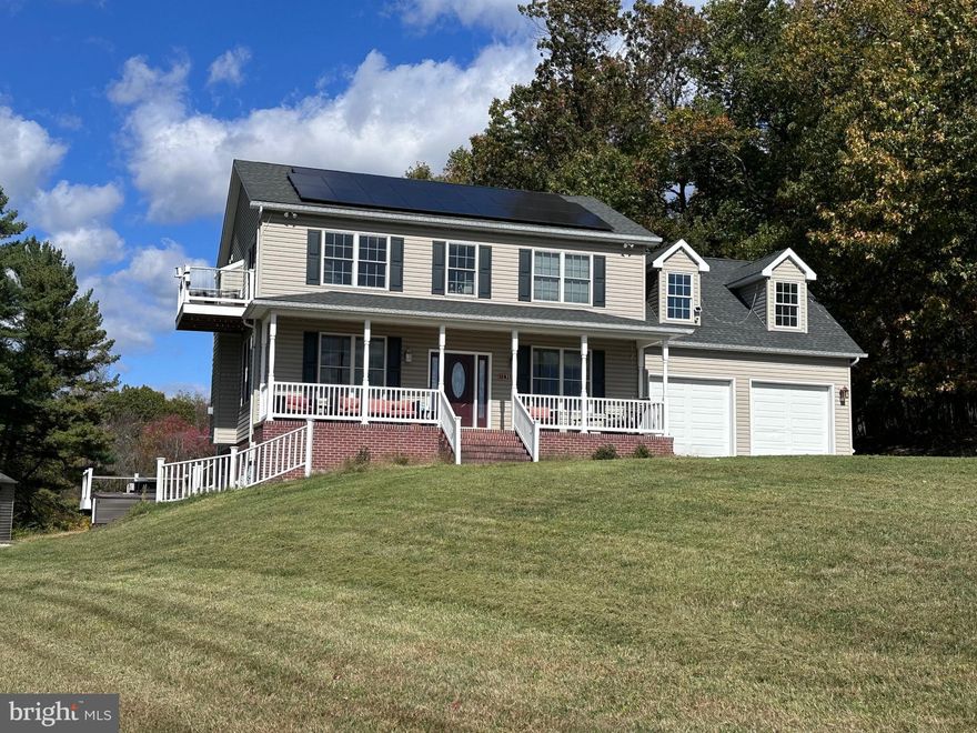 Private Hilltop Retreat with stunning views, In-Law Suite, Owned Solar Panels, & Large Detached Garage – 4.75 Acres in Westminster, MD
Welcome to your private countryside oasis perched atop a hill with breathtaking views of rolling farmland that have no plans to be developed! This exceptional custom home offers 3,400 sq ft of finished living space (2,450 sq ft. above grade + 950 sq ft. in the stepout basement apartment) on 4.75 partially wooded acres, surrounded by 60 acres of protected open farm land for ultimate privacy and serenity. This home provides exceptional versatility for lineal living, guests, or rental potential.
Main and Upper Level Highlights:
•  3 spacious bedrooms + 2.5 baths 
•  Gorgeous hardwood floors throughout
•  Expansive living room with large windows framing panoramic countryside views and a cozy propane fireplace
• Updated kitchen featuring a 48” 8-burner double-oven range with stainless vent hood, 3’ x 6’ island, quartz countertops, updated backsplash, and all stainless appliances
•  Luxurious master suite with propane fireplace surrounded by granite; en-suite bath boasting heated tile floors, oversized tiled step-in shower with rain head, relaxing jetted tub, double quartz vanity, and a large step-in closet complete with built-in shelving and laundry
•  Two additional large bedrooms and a full bath on the second floor
Fully Independent Basement Apartment:
•  Stepout level with separate entrance – perfect for in-laws, guests, or rental income
•  Large bedroom, open living area, kitchen with full-size stainless appliances
•  Full bath with double sink vanity, tiled tub/shower combo, and heated tile floors
Outdoor & Utility Features:
•  Attached 2-car garage
•  Oversized detached 3-car garage (easily fits 6 cars!) with car lift and additional storage room above
•  Additional pull-off parking for 2 more vehicles
•  Separate storage shed
•  Two-level deck off the back for entertaining with location for hot tub off lower deck
•  Large front porch for relaxing mornings and beautiful views
•  Owned solar panels (no lease!) that cover 100% of electric expense – even with daily charging of 2 electric vehicles!
Located on the desirable east side of Westminster, you’re just minutes from shopping, dining, and downtown amenities, with easy commutes to Baltimore, Ft. Meade and other Northern suburbs of D.C. This rare combination of incredible views, luxury finishes, energy independence, large garage space for hobbyists or collectors, and unbeatable privacy on acreage makes this property truly one-of-a-kind. Perfect for anyone seeking peaceful country living with convenient access to town. Don’t miss your chance to own this peaceful, turn-key retreat in one of Carroll County’s most sought-after areas.