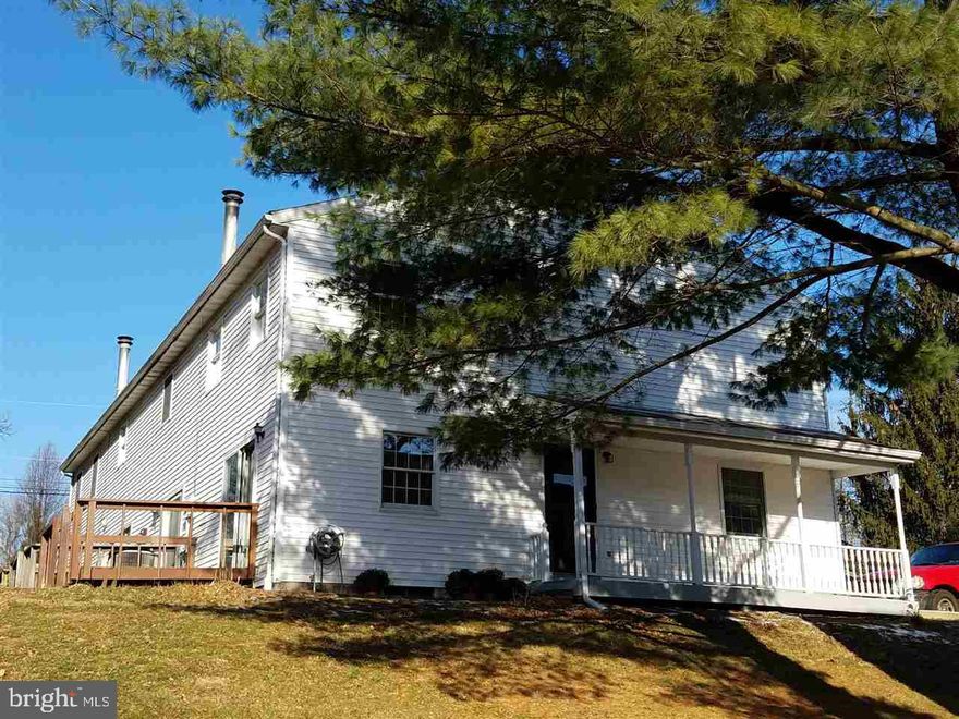 Move in ready! This newly updated condo has new laminate flooring throughout.  Kitchen opens to dinning area.  Nice big fireplace in living room.  End unit has small private area for gardening with private parking.