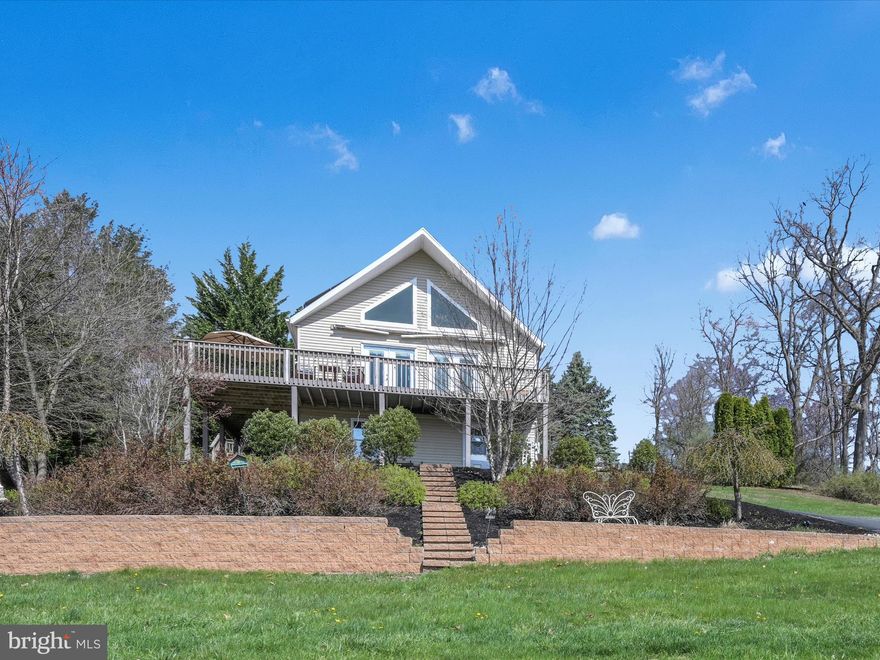 This inviting, 3BR/2BA chalet nestled on 0.99 acre in the gated, Lake Wynonah HOA community offers a perfect blend of rustic charm and modern comfort. Enjoy the unique and inviting aesthetic of this chalet-style home, with its sloping roof, charming features and spacious, wrap-around deck with stellar sunset and mountain views. Featuring 3 bedrooms, 2 bathrooms and a finished basement with additional unfinished storage space, this home is ideal for families or those seeking comfortable living in a private, picturesque community. The main floor encompasses an updated kitchen with center island, living area, 2 bedrooms and a full bathroom. The appealing loft space includes an additional bedroom or office and full bathroom. The cozy basement is partially finished, and boasts a propane fireplace for warmth and ambiance. Large, unfinished area in the basement useful for multiple purpose/laundry. Plenty of extra parking space graces the property, as well as a private deck with firepit area and gazebo toward the rear. Notable features include: fresh, neutral paint colors, bright, open feel, center kitchen island and upgraded countertops, composite, wraparound deck, electric awning with remote, extensive hardscaping and landscaping, invisible fence with dog collars, shed, water filtration system, 3 wall mounted mini-splits, on-site septic. Propane for propane fireplaces (2) is leased through Koppy's. Pergola, Shed, Washer/Dryer, Dehumidifer, Deep Freezer, Dishwasher, Refrigerator, Double Range, large TV in Living Room included in the sale. Solar leased through Sunrun solar. HOA requires a 6 month minimum term rental policy. Lake Wynonah is a gated, HOA community, featuring 2 gorgeous, pristine, spring-fed freshwater lakes (Lake Wynonah is approximately 90 ft. deep and Fawn Lake 45 ft. deep at deepest areas). Amenities include: business office/gathering room/library, lodge w/dining and bar, social clubs, boating, fishing, wakeboarding, waterskiing, tubing, paddleboarding, tennis, pickleball, several parks/pavilion, basketball courts, horseshoe pits, 2 pools, beautiful docks, hiking, natural wildlife and marina. Groups and events include: Active Civic Association, Dances/Concerts, Book Group, Pinochle Group, Volunteer Programs, Fish & Boat Group. Located less than an hour from Allentown, Harrisburg, Hershey and Reading. Close to Philadelphia and surrounding suburbs. Beat the beach traffic, explore and settle in at the lake. Lake Wynonah is "Life On Vacation"!