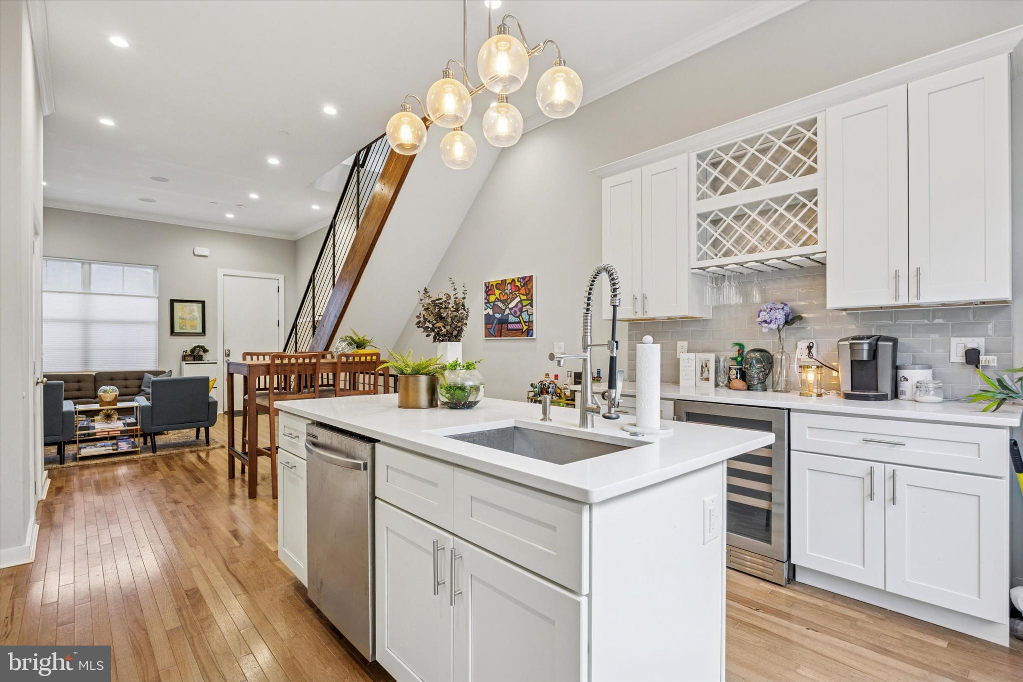 This stunning 3-story townhome checks every box: private deeded parking, incredible natural light, and high-end finishes throughout. Located on the border of Point Breeze and built in 2021, the home offers 4 bedrooms, 3.5 baths, a finished basement, and 6 years remaining on its tax abatement.
Step inside to be greeted by soaring 12-foot ceilings and the warmth of hickory hardwood floors that set the tone for the luxury within. The open main level offers a wide 16-foot floor plan, seamlessly flowing from a spacious living area to a bright dining space and into the chef’s kitchen. Here, you’ll find shaker-style cabinetry, quartz counters, a contemporary backsplash, oversized island seating, a wine cooler, and modern lighting. Unlike most in the development, this home also features an upgraded first-floor powder room. Sliding doors lead to a private rear patio perfect for grilling or al fresco dining.
Upstairs, two spacious bedrooms with generous closets and natural light flank a modern full bath. The third level is a dreamy primary suite with a walk-in closet, bay window, and spa-like bath featuring a soaking tub, glass-enclosed rainfall shower, and double vanity. A wet bar with a second wine fridge makes entertaining easy, whether in your suite or on the expansive roof deck with panoramic skyline views. The fully finished lower level adds even more flexibility with a bonus bedroom, full bath with a floor to ceiling glass panel, and storage.
This home is also future-ready, outfitted with hardwired speakers and Bluetooth capabilities for a seamless smart-home experience.
Outside, you’ll love not only your private deeded parking, but also the abundance of additional guest parking under the 25th Street overpass. The location is unbeatable: walking distance to the Schuylkill River Trail and Grays Ferry Crescent Park, connecting all the way to the Art Museum for morning jogs or evening bike rides. Enjoy coffee at nearby Grays Ferry Coffee Shop, playtime with your pup at Lanier Dog Park, and watch your equity grow as new homes, restaurants, gyms, and shops continue to rise in the neighborhood and along Washington Avenue.
Ask the listing agent about an incredible loan program this home qualifies for: just 3% down, 1% off the current interest rate, no mortgage insurance premium, plus $4,000 towards closing costs for first-time buyers. This program paired with the tax abatement will make this dream home affordable!
Don’t miss the chance to own a home that blends luxury, lifestyle, and long-term value. Schedule your showing today!