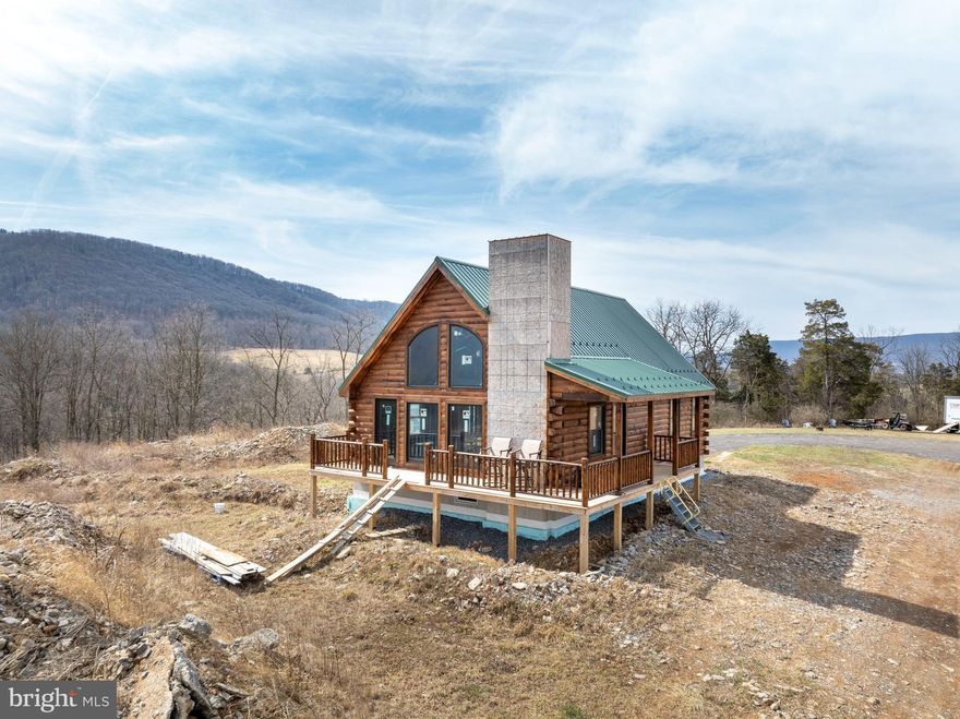 Seeking the ultimate in privacy? Your dream home awaits at 228 Doc Holiday Lane! This brand-new log cabin is primed for your personal touch, with the heavy lifting already completed in one of the most breathtaking locations imaginable. The main structure, crafted from beautiful white pine, has been skillfully stained and sealed. Premium Anderson doors and windows grace the main level, adding to the home's charm. Inside, soaring vaulted ceilings create an open, spacious atmosphere, offering endless possibilities — including space for a primary bedroom and a large loft above. The unfinished basement offers potential for a cozy den, workshop, or extra storage. If you'd rather not start from scratch, a full set of plans is available to help you envision the next steps. Spanning 14 acres, the property provides plenty of room for gardens, outbuildings, and more. Additionally, there’s an insulated horse shed and pasture with solar-powered electric fence already in place. This is the perfect setting to build your own lasting legacy.
Experience peace, serenity, and an extraordinary lifestyle at 228 Doc Holiday Lane!