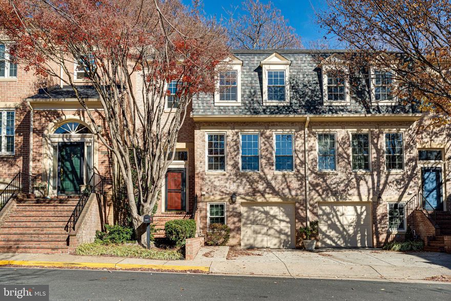 Located in one of the most desirable areas. Spacious and luxuriously renovated garage townhouse in upscale McLean Mews. "NO CARPET IN THE PREMISES." Natural Bright Lights. This neighborhood offers a prime, quiet setting away from the main road. This rare, move-in ready property features a full walk-out basement leading from the garage to the backyard. Inside, enjoy a formal living room and dining room with an open concept feel—perfect for entertaining or relaxing in style. The spacious kitchen features hardwood flooring, table space, built-in cabinets to display your favorite things, a large island, gas cook-top and gas stove, with a layout designed for both comfort and functionality. Timeless white cabinetry, (some with glass fronts) along with windows make the kitchen light and bright! On the upper level you will find a spacious primary suite with hardwood flooring and a closet with organized shelving. The amazing updated primary bath offers dual sinks and modern finishes, with a tub and walk-in shower. The second and third bedrooms on the upper level boast hardwood floors and the second full bath is conveniently located. Neutral paint throughout! Don't miss the powder room on the main level as you follow the hardwood stairs to the finished basement. The walk-out basement is filled with natural light, offering flexible space for a home office, game room or recreation room. Get cozy next to the gas fireplace with brick surround. Practical Elfa shelving conveys. Two sliders provide easy access to outdoor living on the patio. Step outside to a private, fenced backyard oasis with premium IPE wood decking—ideal for outdoor living and entertaining. Trees provide privacy and shade. Additional highlights include a one-car garage, plenty of guest parking. With close proximity to shopping, dining, and major commuter routes to Washington, DC, this home offers the perfect blend of charm, convenience, and modern updates. Close to Tysons Corner and Galleria Malls. Close to Great Falls National Park! Top School Pyramid - Franklin Sherman ES/Longfellow MS/McLean HS, Don't miss. It won't last.