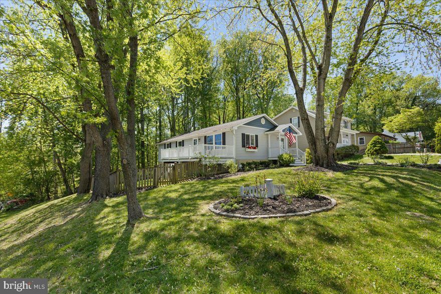 This home is a breath of fresh air! Recently remodeled, you will enjoy the open kitchen plan that adjoins the great room.. There is a wonderful side deck  looking out to your very large fenced back yard. This yard is just what you are looking for for your children, grand  children and pets! The primary suite has it's own private bath and the other two bedrooms share a lovely hall bath.  But wait, there is more! The entire lower level is finished!  A huge space for a recreation room, business in  your home, theater room or what ever you want!  This level features a walk out door to the fenced yard.  Another great feature  is that it is on a corner lot and there is lots of extra parking  along the side yard  in addition to parking right by the entrance.  This home is an unexpected find in the North Beach area and is suitable for so many different lifestyles. Just a few blocks to the North Beach boardwalk, restaurants, shopping  and so much more!