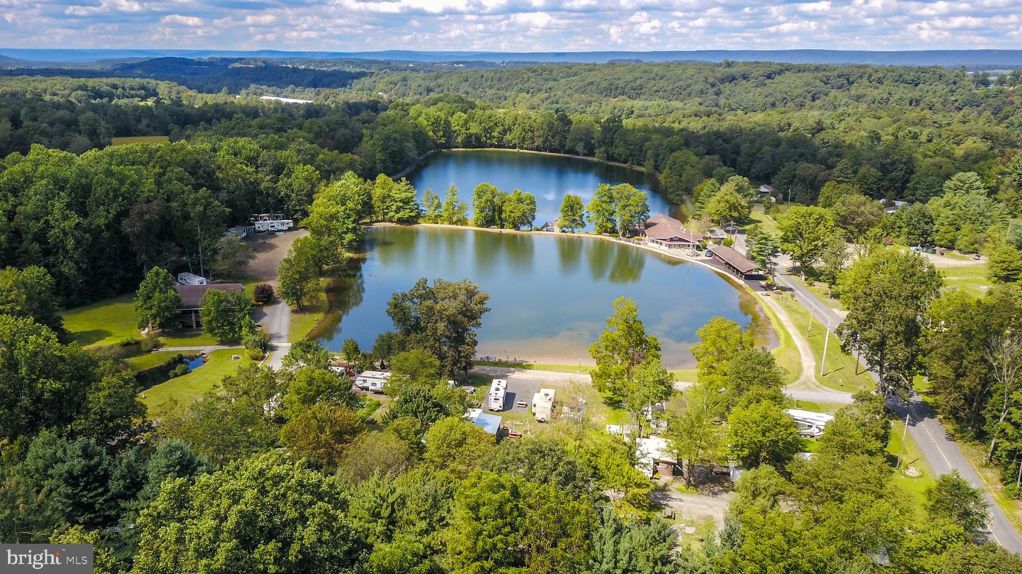 Exclusive 33-Acre Retreat with Lakes, Recreation, and Event Facilities
Welcome to your own private paradise—an exceptional 33-acre property boasting two picturesque lakes, stocked with fish and perfect for your next big catch. This incredible estate is ideal for leisure, recreation, and entertainment, featuring an array of premium amenities that will ensure you experience the ultimate in comfort and convenience.
Key Features:
• Two Stunning Lakes: Spend your days fishing on well-stocked lakes and participate in exciting tournaments! Trout fishing is held the first Saturday in April, May, and June, with cash prizes for participants. Catfish tournaments are hosted in June, July, August, and September, with dates to be announced. The catfish tournaments run from Friday at 5 PM until Sunday at 12 noon, allowing participants to fish all night on both Friday and Saturday.
• Restaurant and Event Space: Delight in a charming on-site restaurant with a cozy sitting bar, offering a relaxing atmosphere to unwind. The adjoining large, enclosed patio is the perfect venue for a variety of events, including weddings, showers, birthday parties, anniversary parties, Christmas parties, family reunions, and more. Inside the restaurant and bar area, we offer 20 seats at the bar, 3 high-top tables with seating for 6 each, 3 booths with seating for 12 in the pool table area, and 4 booths in the large back room with seating for 16. Additionally, there are small tables accommodating seating for 70. Outside, the upper deck has 6 large tables seating 10 comfortably, as well as 6 big green picnic tables that seat 8 each. There’s ample room for any kind of party or gathering you wish to host.
• RV Sites with Full Amenities: Offering 44 spacious RV sites, each with water, electric, and Wi-Fi, you can rest easy knowing that every comfort is within reach. Each site includes a picnic table and fire ring, perfect for outdoor relaxation. A dedicated parking lot is available for extra vehicles, ensuring a smooth stay for you and your guests. Weekly septic services are available for a nominal fee based on the size of your tank.
• Cabins for Overnight Stays: For those seeking a more immersive experience, four charming cabins await. Each cabin includes 3 single bunk beds, 2 receptacles, a ceiling fan with light, windows for natural light, and an outdoor water spigot. A nearby porta potty ensures convenience. Each cabin comes complete with a picnic table and fire ring for your enjoyment.
• Tent Sites: For those who prefer a more rustic experience, 16 tent sites are available, each equipped with a picnic table and fire ring, perfect for enjoying the great outdoors.
• Clean & Modern Shower Facilities: The shower house includes two women’s showers and separate restroom facilities, as well as a men’s shower area featuring two showers and one toilet, ensuring comfort and convenience for all guests.
Additional Amenities and Services:
• Each RV site is equipped with Wi-Fi and is designed to accommodate one vehicle per site. • Weekly septic pumping service ensures hassle-free maintenance (additional charges apply). • A large, well-maintained parking lot for additional vehicles. • Access to a dumpster for your convenience, located in the parking lot.
This property presents an unparalleled opportunity for relaxation, recreation, and entertainment in a serene natural setting. Whether you're looking to host unforgettable events, enjoy world-class fishing, or simply unwind by the lakeside, this stunning 33-acre retreat is the perfect place to call home.
Contact us today to schedule a tour and experience the excitement for yourself. Your new lifestyle awaits!