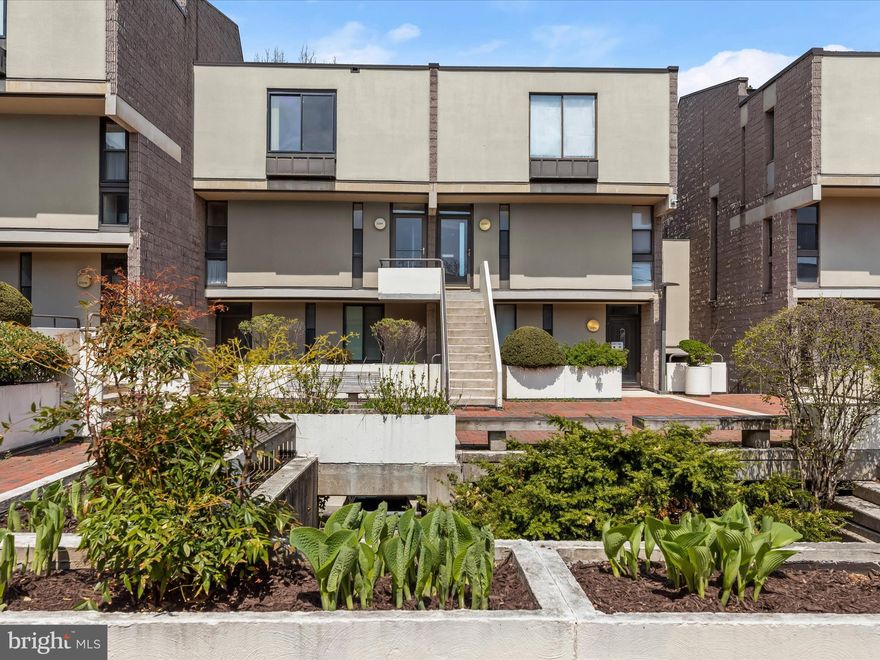 Experience Inspired Living in a Moshe Safdie-Designed Community
Embracing the architectural vision of Moshe Safdie, this contemporary upper-level 3-bedroom, 2.5-bath split-level home offers a thoughtfully designed space that balances function, natural light, and connection to the outdoors. Set within a beautifully landscaped courtyard, this residence provides a unique living experience that blends modern comfort with a tranquil setting. Inside, rich hardwood floors and a neutral color palette flow throughout.  The gourmet kitchen, recently updated with stainless steel appliances, granite countertops, and sleek cabinetry, including display shelving, features a peninsula island with extra storage that seamlessly connects to the dining area. The spacious living room extends to a private balcony, perfect for unwinding in fresh air. The upper levels offer privacy and practicality. The primary suite includes a walk-in closet and en suite bath, while the top level houses two additional bedrooms and a full bath, creating a well-balanced layout for comfortable living. Additional conveniences include garage parking with assigned spaces, a separate personal storage unit, and access to community amenities like a pool and scenic trails. Ideally located near Cylburn Arboretum, Sinai Hospital, I-83, and Towson’s vibrant shopping and dining scene, this home offers a peaceful retreat with easy access to urban conveniences. A home designed for modern living—schedule your showing today!
Note:  Select Interior Photos Have Been Virtually Staged