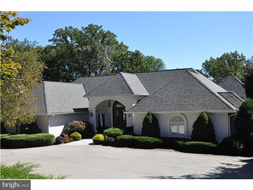 Exceptional 6 bedroom, 6 full and 2 half bath French Mansion styled home set on 1.75 acres at the end of a cul-de-sac in an idyllic Bryn Mawr neighborhood. Sunlit two story Foyer highlighted by chevron marble flrs and leaded glass entry doors open to a dramatic step down formal LR with striking black absolute flrs and coral stone fp. An octagonal tray ceiling in the DR and oversized window affords views of the arrival courtyard while adding to the room's formal appeal. Steps away find the heart of the home in the Kit, adjoining Brkfst Rm and Fmly space. Cashmere Gold granite counter tops and Jerusalem stone back splash with inset metal tile accents, combine with antique white cabinetry for classic yet transitional style.  Quality appliances including Viking professional series and Miele offer a high level performance in an otherwise decorative space. A seated brkfst bar and full sized table are surrounded by a full wall of windows taking in views of the rear yard, pool and tiered terraces.  A built-in pantry and wet bar provide important space for storage and entertaining prep space. The FR offers a flr to ceiling stone fp with convenient gas log system and vaulted ceiling. Also on this main lvl are 4 of the homes 6 bdrms. The deluxe Master Suite offers his and her baths and separate walk-in closets. His with Jerusalem gold stone tiles and handsome inlaid floor with large standing shower and hers with elegant grey polished marble, bubble tub, standing shower with hand formed sub-way tiles and elegant seated make-up area with "brush" sink. This exquisitely designed bath is adjacent to a "dream" closet with multi-lvl hanging, marble topped storage and folding island and master craftsman detailing. Bdrm offers dble doored entry, hand painted ceiling and exceptional, neutral yet elegant decorative choices. 3 other family bedrooms on this level, one with extensive built-ins and en suite bath and the other two with large shared bath. Descend to the Garden Level and find an expansive, fully finished game and recreational rm with wood burning fp, seated area, billiard area, custom bar offering refrigeration, ice maker, display cabinetry and sink. 2 sets of French doors provide lvl access to the pool, gardens and terraces.  2 additional suite-sized bdrms each with en suite bath and generous closet space offer maximum flexibility of flr pln. Separate home theater and mirrored gym and ample storage complete this lvl.  Pristine, well-chosen and beautifully maintained.