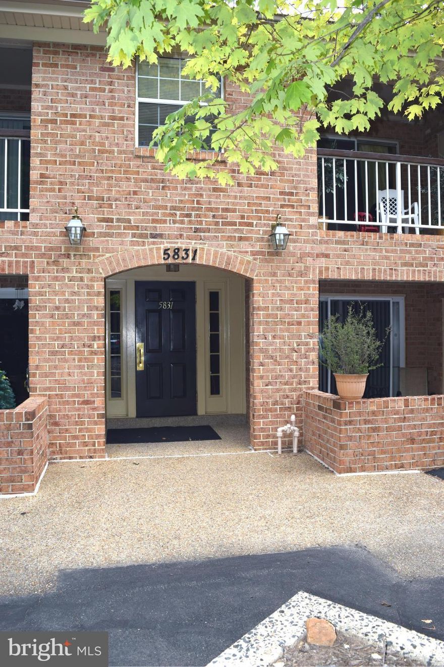 Lovely 2 bed, 2 bath condo! Unit is on entry/ground level from parking spot - NO STAIRS!Unit has updated kitch w/quartz cntrs, ample cab storage, gas stove.Spacious living area with natural light and area for dining table.Private balcony backs to wooded area.AC/Heater replaced in 2012, NEW carpet and paint! 72 sq ft. of climate controlled storage in basement w/outlets. Walk to shops, 5mins to VRE!