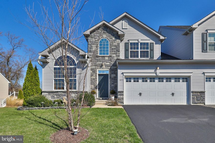 Experience easy living at its finest with a spacious first-floor primary suite that serves as a tranquil retreat, featuring an oversized walk-in closet and a luxurious all-tile ensuite bathroom. This remarkable, nearly new twin home was constructed in 2019 and resides in the sought-after East Penn School District. The residence highlights three bedrooms and two and a half bathrooms designed to accommodate modern living. Throughout the home, polished hardwood floors add warmth and sophistication, while expansive windows bathe each room in natural light. The convenient laundry is located on the first floor near the Primary suite. Step outside from the family room onto a premium Trex deck that overlooks the landscaped yard, complete with a built-in firepit—ideal for gatherings or relaxing evenings. The vibrant landscaping is both attractive and low-maintenance, making the outdoor space as enjoyable as it is practical. The main level seamlessly blends the stylish kitchen—featuring granite countertops, hardwood flooring, and a generously sized pantry—with the inviting family room showcasing a cozy gas fireplace and the formal dining room with a beautiful arched window. Upstairs, you’ll find two large bedrooms—one with a walk-in closet and another that offers flexibility for guests or as an office. Includes a full bathroom with a tub/shower combo. The full unfinished basement with egress window presents endless customization options, and the property includes a built-in two-car garage plus driveway parking.