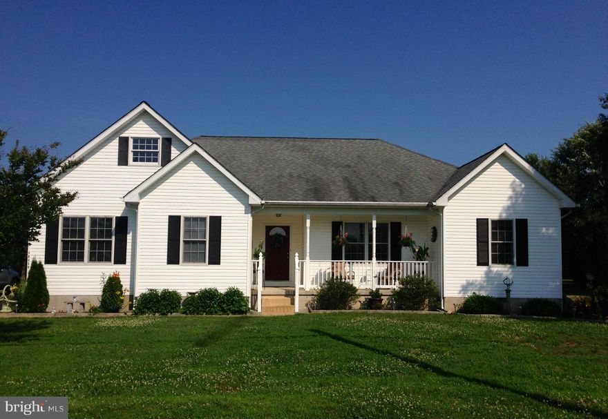 Custom Built Home with Beautiful Hardwood Floors. Custom Hickory Kitchen Cabinets, Fireplace,Gas Stove, Anderson Windows. 3 Bedroom 2 Bath Finished Attic with connected stairs excellent space for an extra bedroom, office or storage. Large spacious bedrooms & closets. Great open floor plan excellent for entertaining. One acre lot with back yard deck and front porch. Country setting in quiet area.