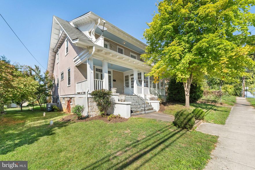 Nestled within the historic downtown Charles Town district, this charming early 20th century home exudes timeless charm and offers a unique blend of architectural character and modern convenience. Preserving the original character, the home boasts hardwood flooring throughout, complemented by wide baseboards and tall ceilings, a pocket door connecting the spacious living areas, and a brick fireplace in the living room. Graced with both a front and rear porch, enclosed sunroom, upper-level balcony, and lovely landscaping, this residence captures the essence of a bygone era while remaining within easy walking distance of shopping, dining, the casino, and all downtown amenities. This home is being offered AS IS in its current condition, presenting an opportunity for customization and enhancement to the discerning buyer's preferences.