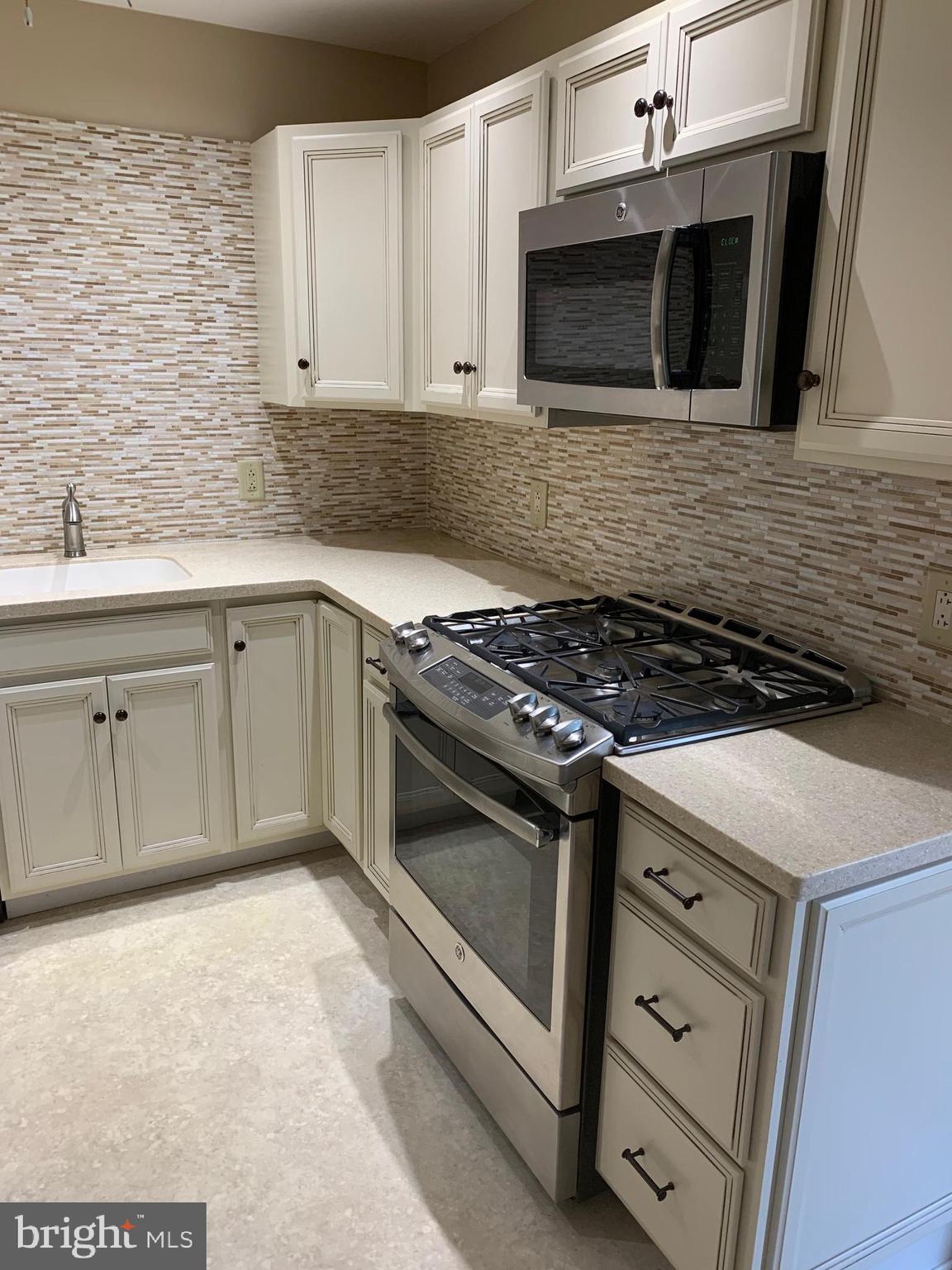 First Floor Condo. Home was remodeled in 2015 and is in great condition. Huge living room with sliders to a nice patio.Spacious eat in kitchen with stainless steel appliances, 5 burner gas stove, dishwasher, and nice Corian counter tops. Beautiful tiled backslash . Just off the kitchen is a bonus room great for office,etc... Large master bedroom with walk in closet. Laundry is shared but located right next door. Also an outdoor POOL!!