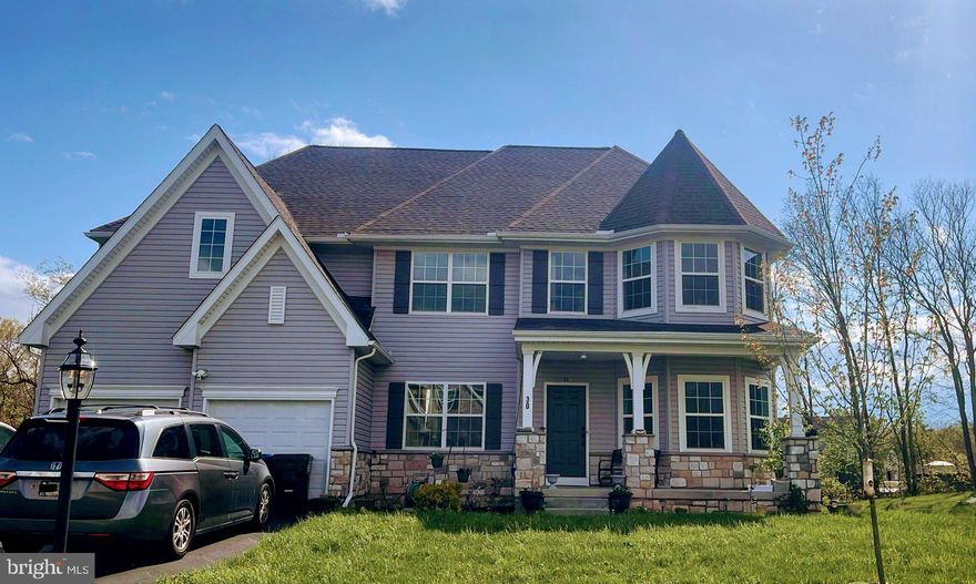 Nestled in a serene setting, this exquisite Colonial-style residence, built in 2023, offers a harmonious blend of modern luxury and timeless elegance. With five spacious bedrooms and four and a half beautifully appointed bathrooms, this home is designed for both comfort and sophistication. Step inside to discover an open floor plan that invites natural light to dance across the gleaming floors. The heart of the home features a 2-story living room adjacent to large kitchen perfect for hosting grand celebrations. The upgraded countertops in the kitchen are complemented by high-end stainless steel appliances, including a sleek gas range with exhaust hood, microwave, refrigerator, and dishwasher, making culinary adventures a delight.

An in-law suite on the main level, complete with a full bathroom, offers unparalleled versatility for multigenerational living.
Retreat to the master suite upstairs, where a generous walk-in closet provides ample storage, while the en-suite bathroom boasts elegant finishes that create a spa-like atmosphere. Each additional bedroom is thoughtfully designed, and features walk-in closets with multi-tier shelving. Equipped with modern recessed lighting throughout and ceiling fans in every bedroom.

The fully finished basement is a true gem, featuring a walkout to the stamped patio that seamlessly connects to the backyard outdoors. A convenient wet bar in the basement adds an extra touch of luxury, ideal for entertaining guests. With a full bathroom, sump pump and ample daylight, this basement is both functional and inviting. This versatile area can serve as a recreation room, home office, or additional living space, catering to your lifestyle needs. 

An expansive full-width deck provides the perfect setting for hosting outdoor events. Enjoy the tranquility of your surroundings with views of lush trees and woods, creating a peaceful backdrop for your daily life. 
The exterior of the home is equally impressive, showcasing a blend of vinyl and stone siding that enhances its curb appeal. The attached garage, with space for two vehicles, and EV charging outlet offers convenience and security. This property is not just a house; it's a lifestyle. Experience the perfect balance of luxury and comfort in a home that is designed for modern living. With its exceptional features and serene location, this residence is a rare find that promises to be a cherished retreat for years to come. Embrace the opportunity to make this stunning property your own and enjoy the exclusive lifestyle it offers.