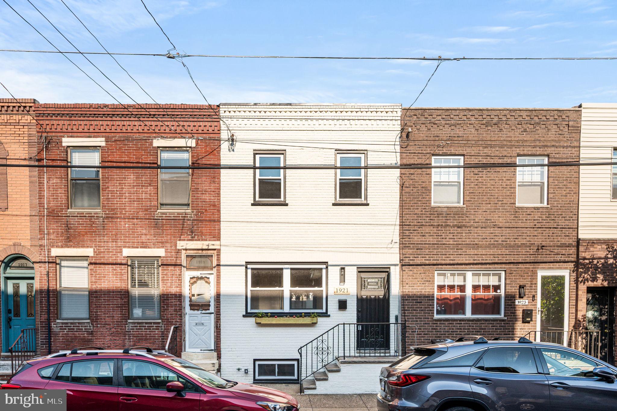 Welcome to 1921 South 10th Street, a rare find in one of South Philadelphia’s most desirable neighborhoods, East Passyunk Square. Situated on an extra-large lot, 15x 63, this fully gutted and completely renovated home perfectly combines modern luxury with classic South Philly charm. Step inside through vestibule to an open-concept living room, dining room, and kitchen with gleaming hardwood floors throughout, ideal for both entertaining and everyday living. The brand-new kitchen is a chef’s dream, featuring stainless steel appliances, granite countertops, and a stylish modern backsplash. This spacious home offers three bedrooms, including a primary with a private ensuite bath, plus another full bathroom and two half baths. The finished basement provides versatile additional living space and houses one of the half bathrooms, perfect for a family room, home office, or gym. All major systems have been updated, including new HVAC, plumbing, electrical, and roof, giving you the peace of mind of a truly move-in-ready home. Located just steps from East Passyunk Avenue’s celebrated restaurants, cafés, and shops, this home delivers the best of South Philly living on a rare oversized lot. Close to public transit and all major highways.