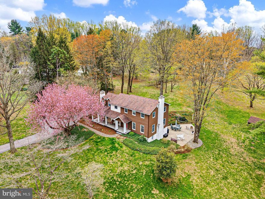 Discover this charming 4-bedroom home nestled on a picturesque 2-acre lot in the coveted Chadds Ford, PA. Blending classic elegance with modern conveniences, this residence offers a warm and inviting atmosphere. As you enter, you're greeted by a spacious family room, highlighted by a striking fireplace that serves as the centerpiece. The family room seamlessly connects to a generously sized eat-in kitchen, complete with updated cabinets, sleek countertops, and stainless steel appliances — perfect for culinary enthusiasts. Adjacent to the kitchen, you'll find both a formal dining room and a cozy living room, providing ample entertaining spaces. French doors from the dining room lead to a composite deck that overlooks the breathtaking landscaped yard, ideal for enjoying serene outdoor living. The main level is adorned with custom dental molding, hardwood floors, and exquisite millwork, adding sophistication to the ambiance. Upstairs, you'll find four well-appointed bedrooms and two fully renovated bathrooms, including a luxurious primary suite featuring a sitting room addition, a spacious walk-in closet, and an elegantly designed bathroom. The lower level boasts a large family room complete with a hearth and wood-burning stove, an updated kitchenette, and an additional full bathroom. A convenient walkout leads to an expansive patio, making this space perfect for hosting gatherings and celebrations. Additionally, an unfinished storage room offers plenty of options for organization and future customization. While the interior is stunning, the true gemstone of this property is the beautifully landscaped lot, an oasis of peace and tranquility. Located within the award-winning Unionville-Chadds Ford School District, this home is a perfect blend of comfort, style, and excellent location. Welcome home!