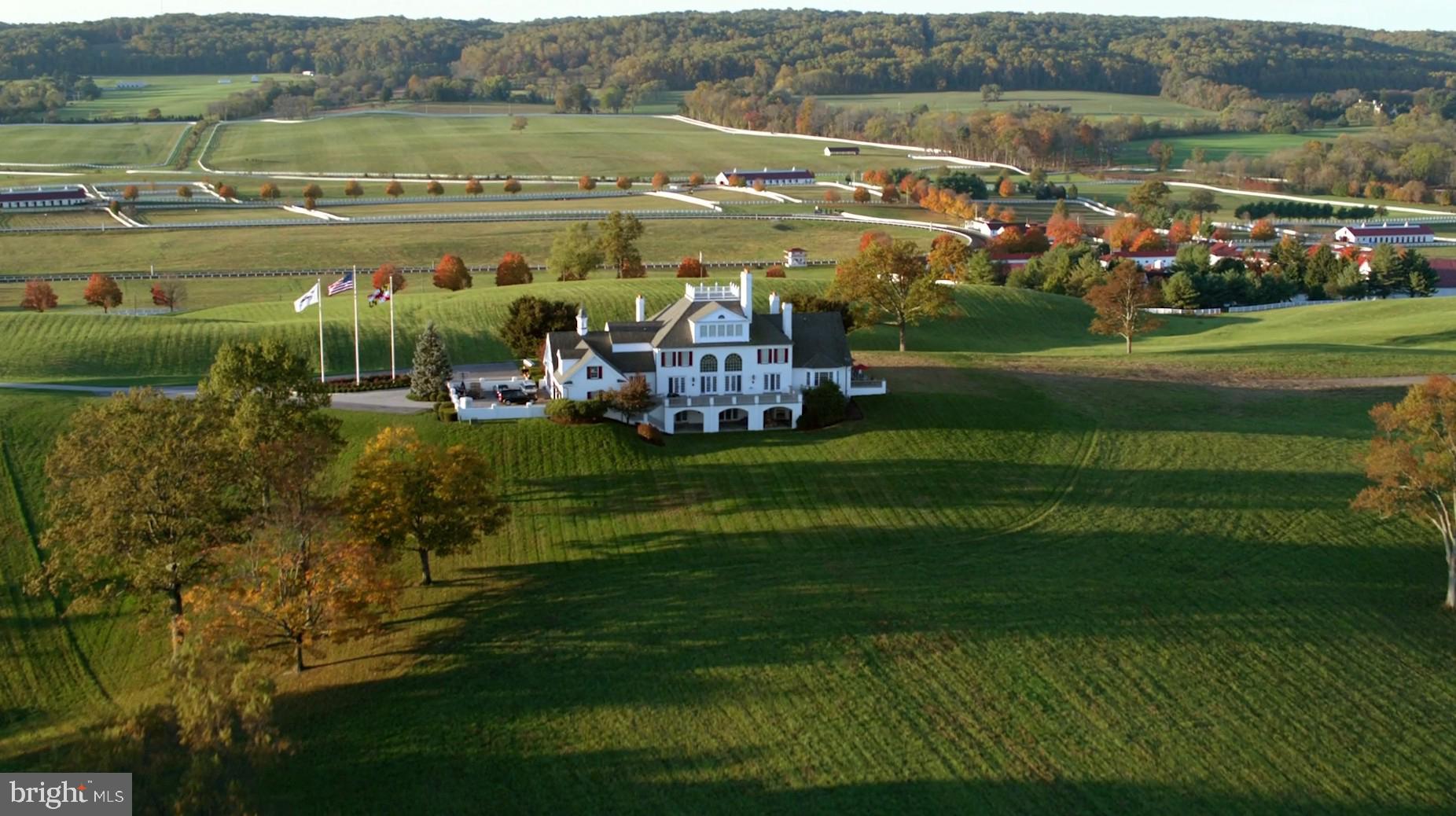 A Legendary Equestrian Estate in Glyndon, Maryland.
Set on over 500+ acres of rolling countryside in a prime mid-Atlantic location, Sagamore Farm offers a premier breeding and training ground for the thoroughbred racing industry. Steeped in history, this estate
offers a rare opportunity to own a horse racing facility designed for excellence and
versatility, with room to expand into other equestrian disciplines (lay-ups, show jumping,
dressage and more) as desired. At the heart of the estate lies a stately 16,000-square-foot
residence, commanding breathtaking views of the maintained grounds. With seven oversized
en-suite bedrooms, this grand home is designed for both elegant entertaining and
luxurious everyday living. From expansive living spaces to its serene connection with the
surrounding equestrian landscape, this home offers a rare blend of comfort, elegance, and countryside charm.. The Farm offers three fully renovated barns providing easy access to
numerous turnout paddocks, ensuring optimal care for every horse. Additional stalls are
available throughout the property to accommodate growing operations. The state-of-the-art
Tapeta synthetic track offers superior footing for training, while the newly constructed
Clocker’s Tower provides a commanding vantage point for overseeing training or hosting
meetings in a refined conference room. The estate’s long-serving General Manager and his
team of expert groundskeepers have ensured Sagamore Farm remains a benchmark of
equestrian excellence for over 17 years. For staff and jockeys, the recently built Bunk House
offers well-appointed accommodations with multiple apartments, ensuring comfort and
convenience. Perfectly situated with easy access to I-83, I-695, BWI Airport, Washington,
D.C., and New York, Sagamore Farm offers unparalleled connectivity to the world’s most
prestigious racing venues, including the iconic Triple Crown. Whether seeking a
legacy property for breeding and training or a visionary expansion into new disciplines,
Sagamore Farm is a rare offering of exceptional grandeur, equestrian heritage, and truly
limitless potential. Please contact the listing agent for additional information.