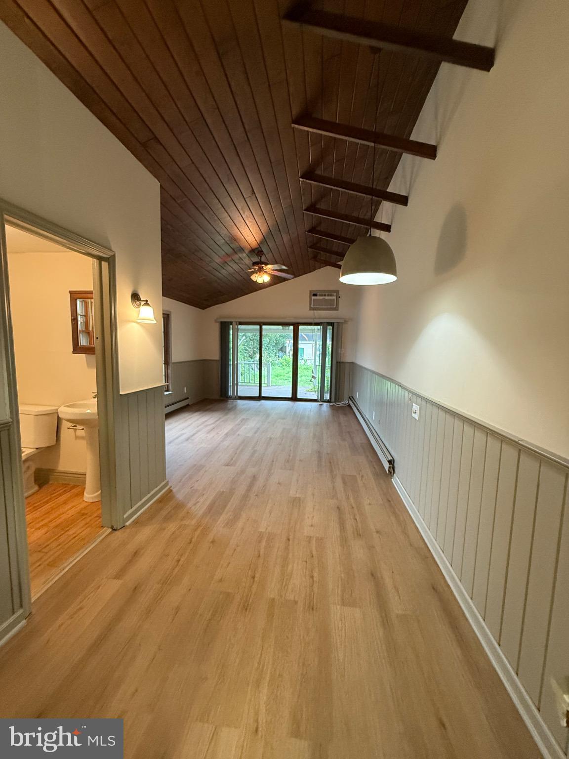 Newly renovated! This large 4-5 bedroom house sits on more than a half acre. You won't believe all the space! There are so many ways to utilize all this space. Walk into a large entry room connecting to an eat-in kitchen which sits next to a large Living Room with vaulted ceiling and full bathroom and sliding doors to the big yard. There is a bedroom and full bath in front. Versatile additional room with low ceilings and built in lighting. Second floor has two bedrooms and a full bathroom. Third floor bedroom has high ceiling as well. High hats and built-in lighting throughout. New floors and new carpet throughout. Laundry in basement. Convenient to all public transportation.