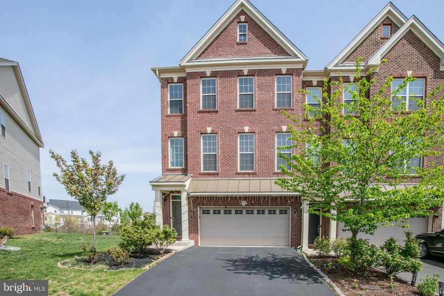 Live Luxuriously in the Heart of Ashburn – Stunning 3-Story End-Unit Townhome

Experience refined living in this elegant 3-story end-unit townhouse, perfectly situated in one of Ashburn’s most vibrant and sought-after communities. Boasting 3 spacious bedrooms and 3.5 beautifully appointed bathrooms, this home is thoughtfully designed with premium finishes and modern upgrades throughout, offering the perfect blend of comfort, style, and sophistication.

Step inside to an expansive open-concept floor plan bathed in natural light. The main level features a chef-inspired gourmet kitchen with a sprawling granite countertop, sleek stainless steel appliances, and ample cabinet space, perfect for entertaining and culinary creativity. The seamless flow continues to a generous dining area and sunlit living room adorned with rich hardwood floors, leading to a private deck with peaceful views, an ideal spot to relax or entertain.

Retreat upstairs to the luxurious primary suite, a true sanctuary with an upgraded spa-like en-suite bath and two luxury-style his-and-hers walk-in closets. The upper level also includes a conveniently located laundry room and additional well-appointed bedrooms, each with thoughtful details that elevate everyday living.

The lower level is just as impressive, featuring a spacious recreation room ideal for movie nights, a home gym, or play space. From here, step out to a beautifully paved patio, perfect for outdoor lounging or hosting summer evenings under the stars.

Additional highlights include:

Elegant custom blinds and window treatments

Designer lighting fixtures

Tasteful custom accent wall art

Attached garage and driveway parking

Located just minutes from the best of Brambleton, enjoy easy access to top-rated dining, shopping, entertainment (including the movie theater), OneLife Fitness, grocery stores, and scenic walking trails.

This is more than just a townhouse, it’s a lifestyle upgrade. Schedule your tour today and experience luxury, convenience, and community all in one.