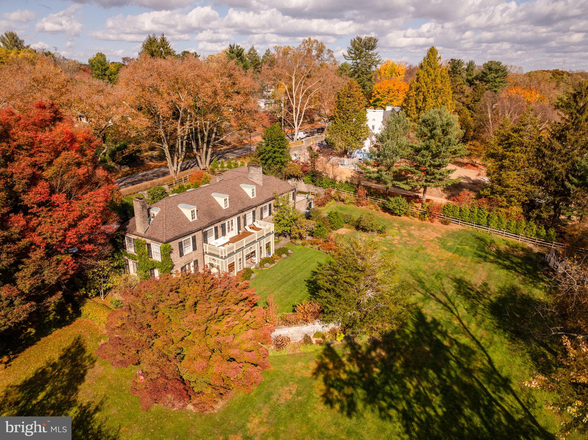 Originally constructed in 1923 by renowned architect Edmund Gilchrist, this exquisite Chestnut Hill residence has hosted esteemed Philadelphians such as Schofield Andrews and Richardson Dilworth. As you step into this remarkable abode crafted from Wissahickon Schist, your gaze is immediately drawn to the grand sweeping staircase gracing the entryway. Throughout the main floor, original architectural intricacies and moldings embellish every corner, complementing the expansive gourmet kitchen seamlessly connected to a cozy family room, a picturesque formal living and dining area, and a generously sized library, perfect for family gatherings. Each of these spaces boasts a fireplace, offering warmth on chilly evenings. Upstairs, a luxurious master suite awaits, complete with its own fireplace and private terrace, accompanied by two additional floors housing bedrooms, bathrooms, and a spacious home office. The lower level presents ample entertainment opportunities, featuring a paneled media room, a full wet bar, and a designated gym area. Attached to the main dwelling is a charming apartment with a private entrance, ideal for a separate office or accommodating guests. Outside, ornate stone walls frame a meticulously designed garden adorned with mature plantings and a captivating tree-lined approach. Just steps away from Chestnut Hill Village and the scenic walking trails of Valley Green, this residence epitomizes timeless elegance and distinctive charm.
This property includes the lot of 440 W Mermaid Lane & 7615 Huron Street.