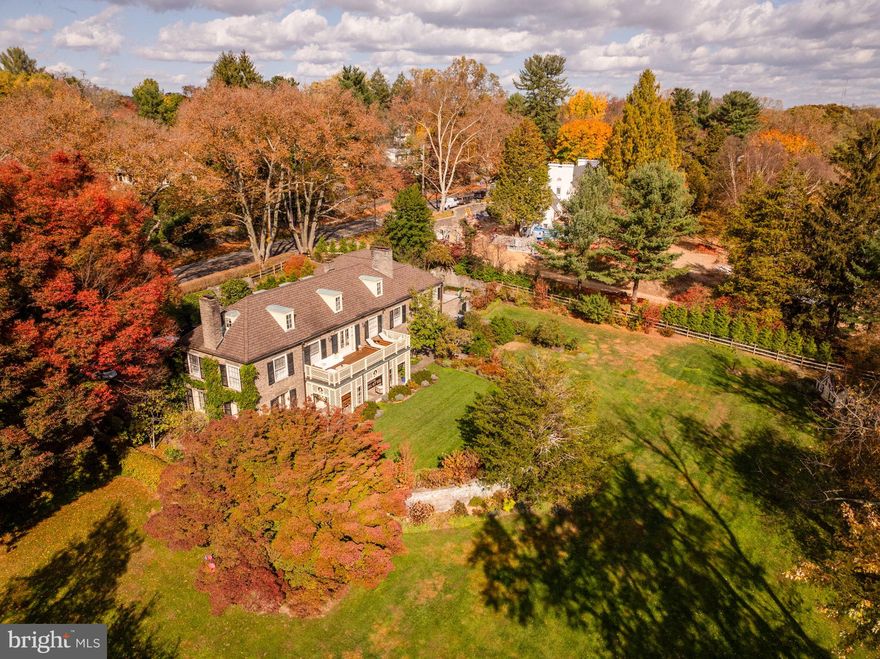 Originally constructed in 1923 by renowned architect Edmund Gilchrist, this exquisite Chestnut Hill residence has hosted esteemed Philadelphians such as Schofield Andrews and Richardson Dilworth. As you step into this remarkable abode crafted from Wissahickon Schist, your gaze is immediately drawn to the grand sweeping staircase gracing the entryway. Throughout the main floor, original architectural intricacies and moldings embellish every corner, complementing the expansive gourmet kitchen seamlessly connected to a cozy family room, a picturesque formal living and dining area, and a generously sized library, perfect for family gatherings. Each of these spaces boasts a fireplace, offering warmth on chilly evenings. Upstairs, a luxurious master suite awaits, complete with its own fireplace and private terrace, accompanied by two additional floors housing bedrooms, bathrooms, and a spacious home office. The lower level presents ample entertainment opportunities, featuring a paneled media room, a full wet bar, and a designated gym area. Attached to the main dwelling is a charming apartment with a private entrance, ideal for a separate office or accommodating guests. Outside, ornate stone walls frame a meticulously designed garden adorned with mature plantings and a captivating tree-lined approach. Just steps away from Chestnut Hill Village and the scenic walking trails of Valley Green, this residence epitomizes timeless elegance and distinctive charm.

This property includes the lot of 440 W Mermaid Lane & 7615 Huron Street.