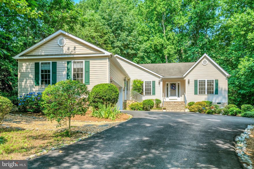 Back on the market to no fault of the seller!  Welcome to 421 Harrison Circle! This amazing, custom-built home nestled in the trees is move-in ready and will delight from the moment you arrive. You will love your water views of the lake  and location so close to the beaches and back gate. Once you enter, you are welcomed by a great room with a corner stone gas fireplace and soaring ceilings. The kitchen boasts plenty of counter space to spread out, as well as a breakfast bar and a dining area! The sitting room off the kitchen will be one of your favorite areas with access to the screened porch. When it comes to entertaining family and friends, the formal dining room and flow of the main living areas are sure to please. The inviting owner's suite is spacious, and the en-suite bathroom offers a double vanity and soaking tub with jets. Bonus room off of the garage makes a perfect craft room. Two additional bedrooms, full bath and laundry room complete the main level. Enjoy your favorite beverage, read a book, or take in the sounds of nature from the screened porch.  A private, gated, secured community, Lake of the Woods offers anything and everything you could possibly want. Home to two lakes (the 550 acre main lake and a 35 acre "fishing lake"), a golf course, an equestrian center, a fire and rescue department, and a church all within the gates, Lake of the Woods simply has it all. Whether your passion is boating, water skiing, kayaking, golfing, horseback riding, or simply taking in the breathtaking views from the clubhouse while enjoying a fabulous meal, from your own deck or yard, or from one of the beaches, you won't be disappointed! Perhaps you'd like a game of bridge or volunteering your time and talents...Lake of the Woods offers more than 60 clubs and/or organizations from which you may choose to become involved. Located in Orange County, we are fortunate to enjoy low real estate taxes. Coupled with home prices ranging from $200,000+ to over $2,000,000, Lake of the Woods is the perfect community for both full-time residents, as well as weekenders. But don't take my word for it, please come see for yourself! I will gladly give you a tour of Lake of the Woods by boat and by car so that you may experience why I love Lake of the Woods!