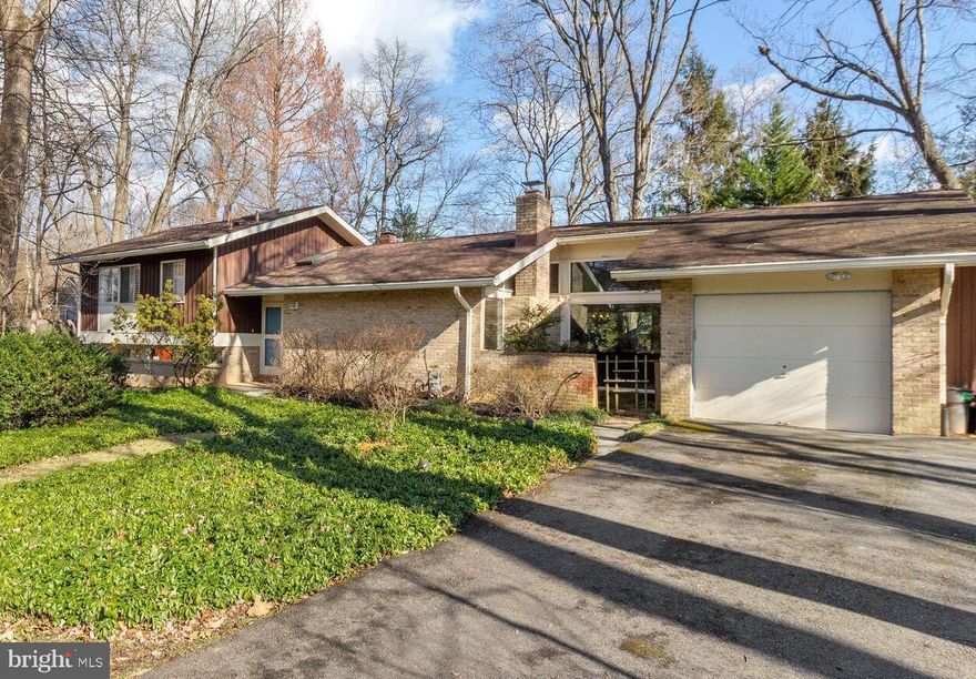 You will be "hooked" from the moment you step inside! A spectacular open floor plan in the  sought-after  Mid Century Modern Neighborhood of  Carderock Springs. An expanded Clubview Model, rarely available... 4 level , 4 BR, 4BA , 1 car garage home with perfect flow for entertaining and family living. The main level offers cathedral ceilings, skylights and  enormous windows filtering  natural light and nature through out the kitchen, living room,  dining room and family room addition. The spectacular addition was designed by renowned Carderock local architect Soe Lin & Associates,  Both dining room and  family room provide access to the patio and deck overlooking a private, mature, and  lovingly maintained landscaped garden and yard.  Floating staircase to the upper and lower level.  The upper level  includes an en suite primary bedroom, a hall bathroom serving 2 other bedrooms.. The  lower walk out level  boasts 9 ft ceilings, an additional family room with glass doors, a small gardening room, and an additional bedroom and bathroom. The basement is partially finished with tile floors and a cedar closet. Walking distance to Carderock SpringsElementary and an easy bike ride to the C&O Canal, parks and restaurants.
