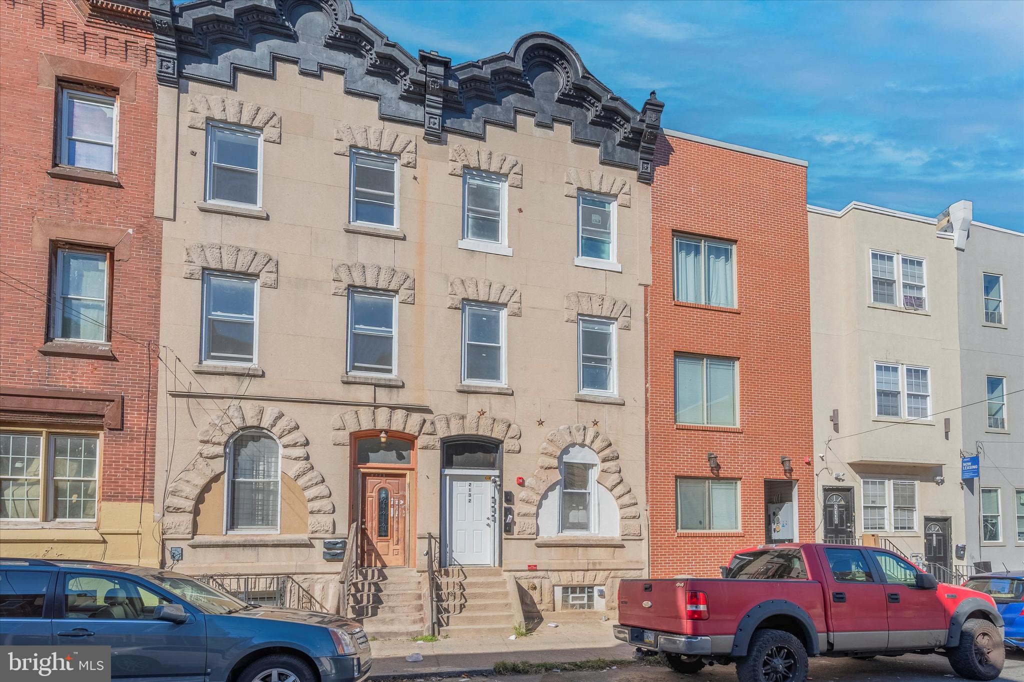 Fully renovated in 2022, this turnkey triplex at 2132 N 18th Street offers a prime investment opportunity in one of Philadelphia’s fastest-growing rental corridors, just minutes from Center City, Temple University, Broad Street Line, and major development zones. Each legal unit is separately metered and thoughtfully updated with modern finishes, mechanicals, and layouts that attract strong, reliable tenants. Unit 1 is a spacious 2 bed, 2 bath bi-level with private basement and backyard leased at $1,145/month, Unit 2 is a bright 2 bed, 1 bath leased at $1,250/month, and Unit 3 is a top-floor 1 bed, 1 bath leased at $1,100/month—generating $3,495/month in rental income with upside potential in future lease renewals. Whether you're looking to add a low-maintenance, income-producing asset to your portfolio or secure long-term value in an appreciating neighborhood with strong student and young professional demand, this property delivers on location, quality, and returns. Steps from public transit, regional rail, local retail, and minutes to Temple’s campus and Center City, this is a rare opportunity to own a stabilized, high-yield asset in a neighborhood poised for continued growth.