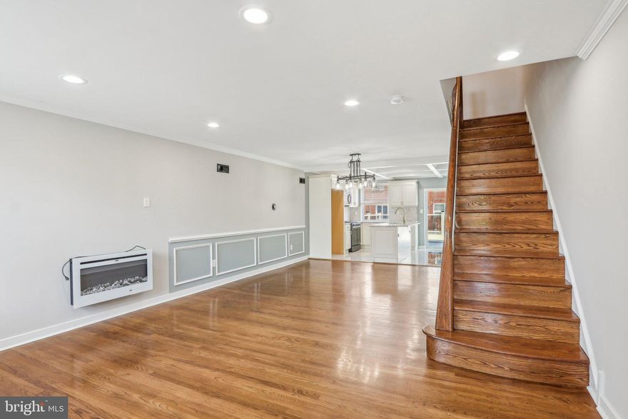 Melrose Park Garden newest Gem! Just move in and unpack! Don’t miss this fully renovated home, located in a serene and peaceful neighborhood. As you approach the property, you’ll be greeted by a well-kept front yard and a charming patio—perfect for outdoor activities and enjoying the fresh air. Step inside to find a convenient entryway closet—ideal for coats and shoes. Original hardwood flooring runs throughout the home, beautifully complemented by freshly painted walls that create a bright and inviting atmosphere. With generous high ceilings, electric fireplace and abundant natural light, the home feels open and airy. The open-concept layout seamlessly connects the living area, dining space, and kitchen. The kitchen is a cook’s dream, featuring shaker cabinets, stainless steel appliances, and granite countertops, Upstairs, a well-lit hallway leads to the bedrooms. The primary bedroom includes a walk-in closet and a stylish ensuite bathroom. The second and third bedrooms are filled with natural light and thoughtfully designed to provide cozy, personal spaces. Downstairs, enjoy a finished basement with luxury vinyl flooring, a bonus 4th bedroom, a convenient powder room for guests, and a utility/laundry area. An attached garage adds extra convenience for parking and storage. Step outside to a PVC deck—perfect for entertaining—and a private driveway bordered by a PVC privacy fence, offering both function and security. Located just minutes from the train and bus stations, this charming residence offers everything you need to feel right at home.