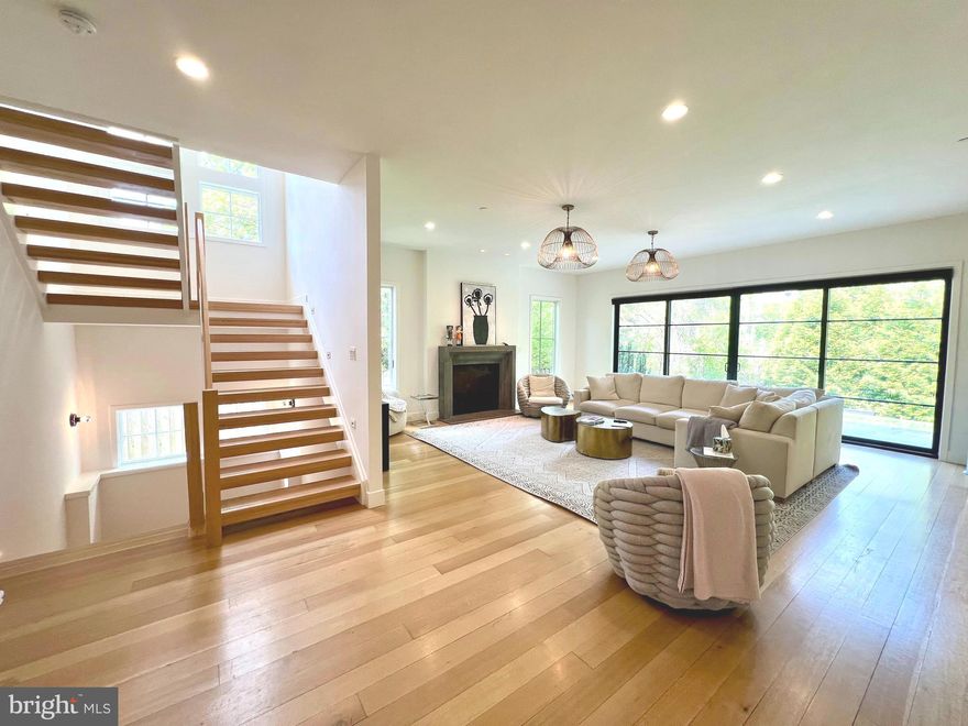 Location, location, location and this gorgeous home is just a short stroll to Friendship Heights, Metro, shopping, restaurants, schools and more... you simply cannot find a more convenient neighborhood. Brookdale is an urban neighborhood, and yet, has a beautiful bucolic village-type feel. A lovely park and playground is mere steps away. This magnificent modern home has every possible amenity from the sundrenched front porch to the vast patio with a natural gas grill. In between you will find a brilliantly and cleverly designed main level with soaring 10 ft. ceilings and a second owner's retreat ideal for out of town guests. All bathrooms have a spa-like sanctuary flair with only the finest finishes. The massive great room/family room features walls of panoramic glass and is perfect for entertaining where you can admire the large but private fenced yard and spill onto the rear patio for drinks and appetizers. The fully equipped dreamy kitchen will be the envy of your friends and features top of the line stainless appliances, a wine refrigerator, professional range and a triple bright picture window. The massive center island has a darling recess to place food and water for the family pooch. The dining room is decorated in a vibrant green wallpaper and is open to a massive reception hall allowing for tables and chairs to go beyond the defined space. The dramatic open tread blonde wood staircase is drenched in sunlight and features a soaring window to light your way. The upper level is expertly designed and you will want to take your time to meander so you don't miss the wonderful details. A convenient laundry room is located at the top of the stairs and has lots of built-ins, storage and a rolling canvas laundry basket is accessible from the owner’s closet so you simply push it through and voila! Three large bedrooms with ensuites are found on this level of the home in addition to a fabulous loft area. Also on this level is a generously sized office (or additional bedroom). The lower level is enormous and boasts even more smart amenities including a fabulous recreation room, a  6th bedroom, a 5th full bathroom and a beautifully designed wet bar. Do not miss the geometric style-tile in the full bathroom. A convenient storage room lined with shelves and a very durable stained concrete floor are also found on this level of the home. The owners have thought of everything in this expertly designed home and no expense was spared and no detail overlooked when building this forever home!  Put this one first on your list... it won't be available for long!!!