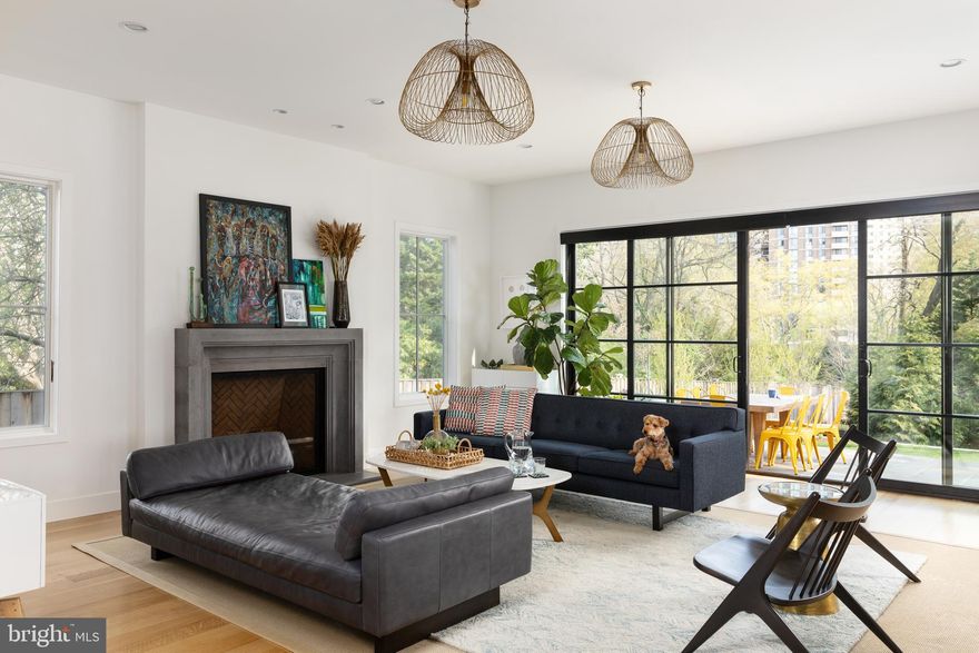 Location, location, location and this gorgeous home is just a short stroll to Friendship Heights, Metro, shopping, restaurants, schools and more... you simply cannot find a more convenient neighborhood. Brookdale is an urban neighborhood, and yet, has a beautiful bucolic village-type feel. A lovely park and playground is mere steps away. This magnificent modern home has every possible amenity from the sundrenched front porch to the vast patio with a natural gas grill. In between you will find a brilliantly and cleverly designed main level with soaring 10 ft. ceilings and a second owner's retreat ideal for out of town guests. All bathrooms have a spa-like sanctuary flair with only the finest finishes. The massive great room/family room features walls of panoramic glass and is perfect for entertaining where you can admire the large but private fenced yard and spill onto the rear patio for drinks and appetizers. The fully equipped dreamy kitchen will be the envy of your friends and features top of the line stainless appliances, a wine refrigerator, professional range and a triple bright picture window. The massive center island has a darling recess to place food and water for the family pooch. The dining room is decorated in a vibrant green wallpaper and is open to a massive reception hall allowing for tables and chairs to go beyond the defined space. The dramatic open tread blonde wood staircase is drenched in sunlight and features a soaring window to light your way. The upper level is expertly designed and you will want to take your time to meander so you don't miss the wonderful details. A convenient laundry room is located at the top of the stairs and has lots of built-ins, storage and a rolling canvas laundry basket is accessible from the owner’s closet so you simply push it through and voila! Three large bedrooms with ensuites are found on this level of the home in addition to a fabulous loft area. Also on this level is a generously sized office (or additional bedroom). The lower level is enormous and boasts even more smart amenities including a fabulous recreation room, a  6th bedroom, a 5th full bathroom and a beautifully designed wet bar. Do not miss the geometric style-tile in the full bathroom. A convenient storage room lined with shelves and a very durable stained concrete floor are also found on this level of the home. The owners have thought of everything in this expertly designed home and no expense was spared and no detail overlooked when building this forever home!  Put this one first on your list... it won't be available for long!!!