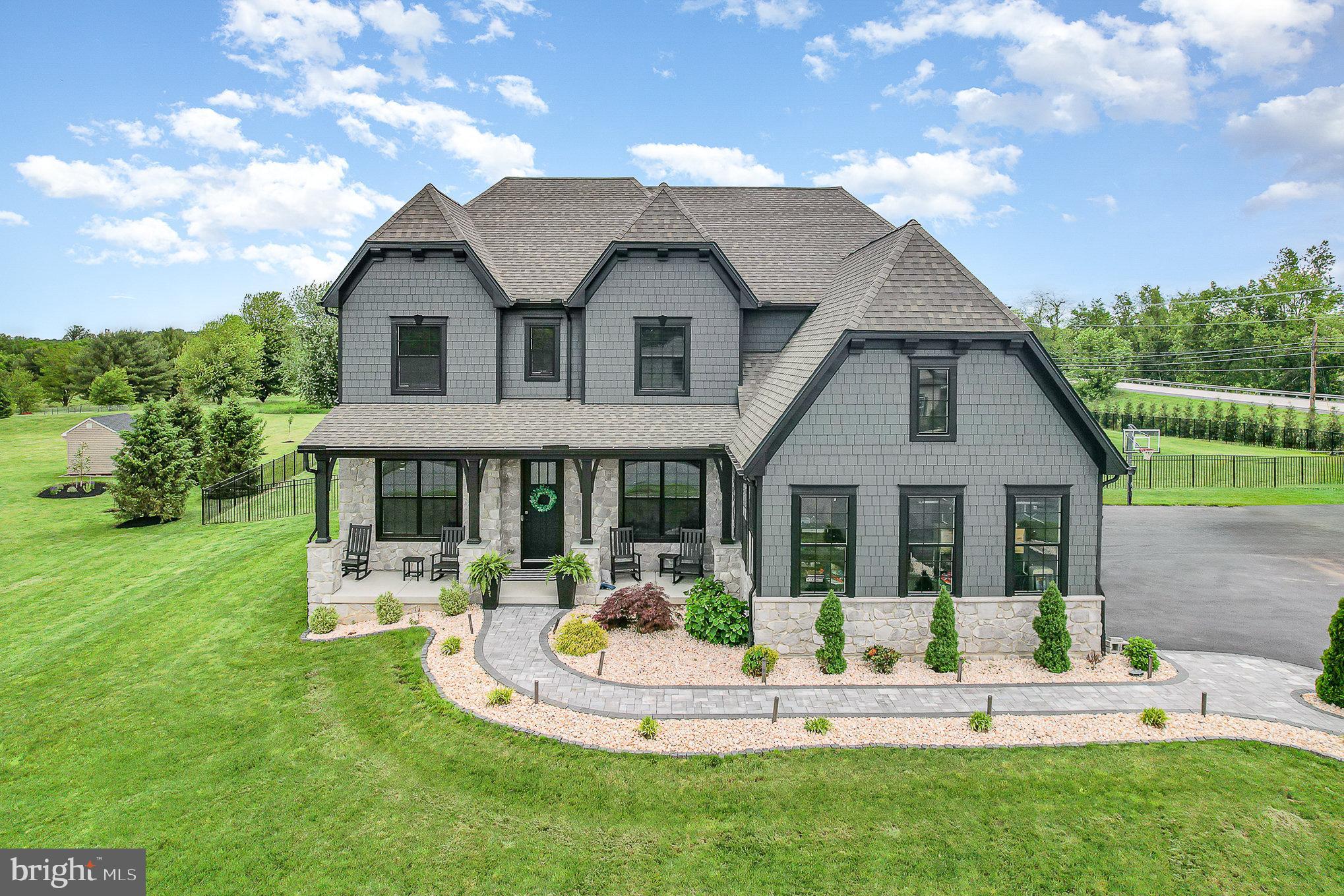 Welcome to Freedom Court, nestled on the scenic 183-acre Rich Valley Golf Course overlooking hole 15. This stunning custom-built home exudes character, craftsmanship, and chic finishes! It all starts with a beautiful paver walkway to a covered front porch. Upon entering, you are greeted by 10-foot ceilings and a modern open floor plan with a formal dining area and a sitting room including a gas fireplace and a wet bar. The floor plan extends to an open 2-story great room with coffered ceilings and sliding doors opening to your backyard oasis, stunning kitchen, and additional dining space. Dine in with a gourmet eat-in kitchen featuring luxurious quartz countertops, GE Cafe Appliances, custom range hood, ceramic tile backsplash, a massive walk-in pantry, and a large island perfect for prep work, and includes a seating area and overhang. The main level additionally offers a mudroom, powder room, and a first-floor en suite! The second floor boasts 9-foot ceilings, a laundry room, 3 full bathrooms, and 4 bedrooms, including an impressive primary bedroom suite! Stepping into the primary bedroom suite, you will notice vaulted ceilings, an accent wall, a private gym area, and two enormous walk-in closets. The en suite bathroom is lavishly finished with a double vanity, penny tile backsplash wall, soaking tub, separate water closet, and a grand walk-in tile shower configured with multiple shower heads and a sitting bench. The lower level offers additional finished space with a 40’x17’ rec room, half bathroom, and the enjoyment of your personal home theater room with stadium seating. The lower level also offers plenty of additional unfinished space for all your storage needs. Moving outside, you are greeted by a resort-like setting with extensive hardscaping, a heated inground salt water pool with lounge chair seating, hot tub, fire pit, and a poolside cabana extensively outfitted with a 9 speaker and subwoofer entertainment system, 90 inch TV, and an outdoor kitchen including a grill, flat top grill, Italian stone pizza oven, ice bin, and refrigerator! Additional features include hardyplank siding, a 3-car side-entry garage, a half-court basketball area, extensive landscaping, and more! This one-of-a-kind estate offers refined living, close to it all. Schedule your private showing today for the full experience!