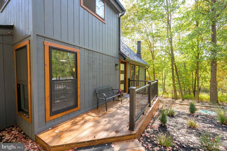 Welcome to your dream home in The Woods Resort!! JUST PACK YOUR BAGS! This beautiful chalet boasts 3 bedrooms, 2 full baths, a large great room/ kitchen /dining combination area with a wall of windows ... plenty of room for lots of  entertaining!  The interior has been remodeled with a new kitchen, granite counters, tiled backsplash, new stainless appliances and all new cabinetry!   You'll never need to replace the roof, it's complete with a brand new black metal roof and new gutters.  Check out the side deck with a privacy wall for reading, relaxing or taking a nap. If you are looking for a different kind of lifestyle, you need to take a look at this property.