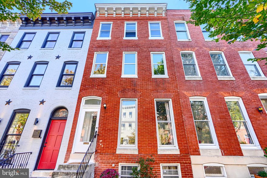 Circa 1880 Union Square townhouse offers a combination of original details complemented by 21st century updates for comfortable living. Curved staircase, 9' ceilings, floor-to-ceiling windows, & period mantel. New oak floors, newly renovated chef's kitchen with marble island and countertops, abundant natural light throughout, deck and large backyard with southern exposure. Open plan design - one large room for kitchen & dining. Bosch induction range, Bosch dishwasher,  beverage cooler, counter seating.  Oversized Marvin sliding glass door bathes the main level in natural light and leads to a large deck that is perfect for entertaining. Deep backyard with southern exposure - a blank canvas for creative landscaping. New 3rd floor suite with tile bath & adjacent walk-in closet/dressing room (2025).  Large basement with stainless steel utility sink and work station. Bedroom level laundry. Convenient to UMB, Union Square Park, Hollins Market, Lithuanian Hall, Mt Clair Junction, downtown, 295 and I-95, cafes, restaurants and shopping.