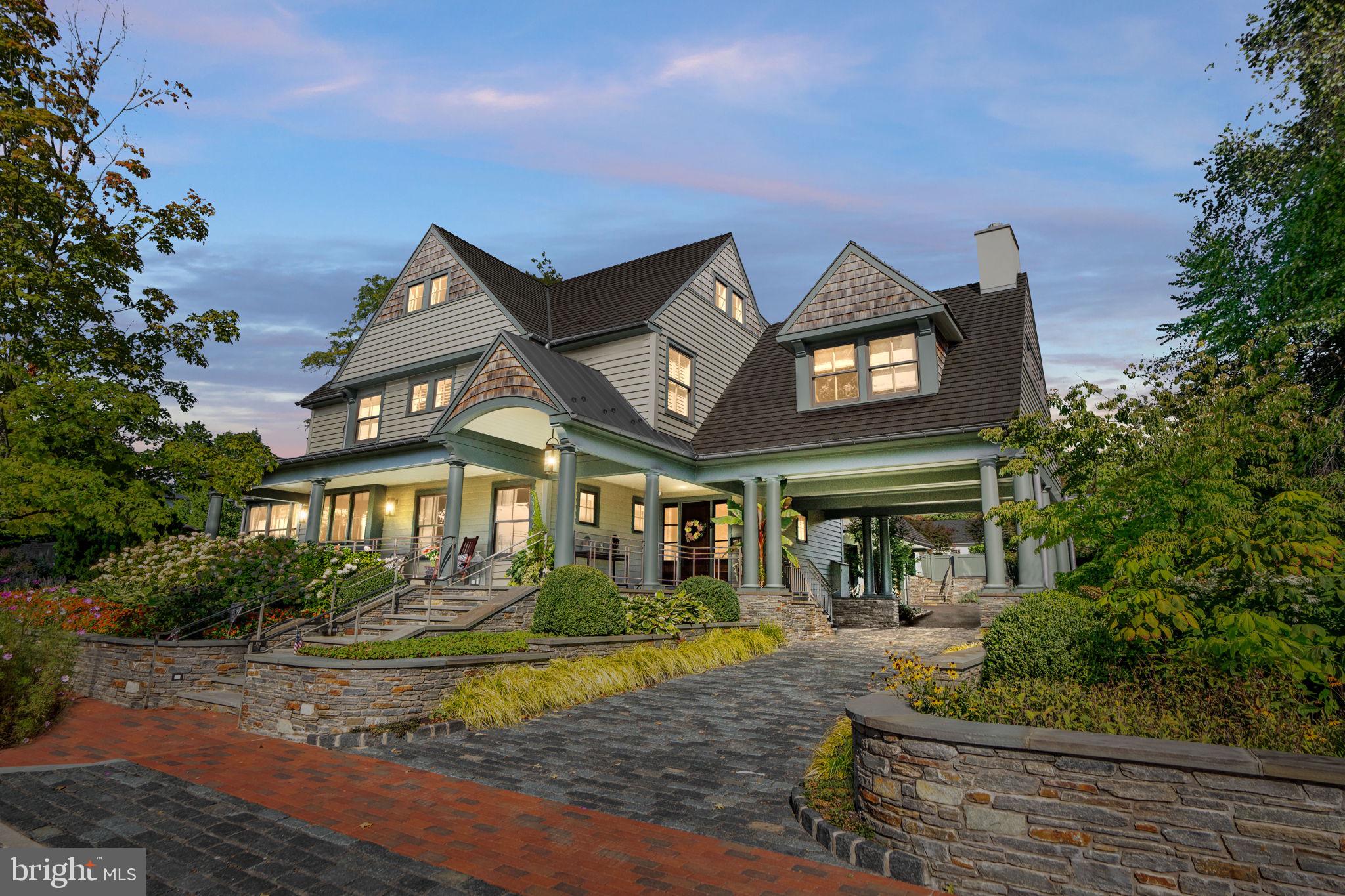 Discover a world of unparalleled elegance where every detail is crafted to perfection, from sweeping architectural lines to the serene outdoor surroundings that envelop this one-of-a-kind retreat. An estate that embodies luxury at its finest nestled in the heart of Doylestown Borough, gracefully set on an oversized, private lot. This home is a true masterpiece of design and craftsmanship built by the acclaimed Jarrett Vaughan Builders of Bucks County.
The approach is an experience in itself. As you arrive, the home’s architectural elegance takes center stage, framed by verdant gardens and stone walls that mirror the beauty of Bucks County’s rolling countryside. Step onto the bluestone front porch and into an entry foyer flooded with light and meticulously laid wide oak floors lead the way through an open, artfully designed layout. The living room welcomes you with an aura of serenity as the multitude of windows allows the scenery outside to become an extension of the interior. Custom built-ins create an understated elegance, perfect for displaying fine art. Adjoining the living area, the kitchen is the crown jewel - a chef’s paradise outfitted with quartz countertops that flow seamlessly and an oversized, custom wood island. Every detail has been elevated, from the professional-grade Wolf six-burner cooktop and oven and the expansive SubZero refrigerator. The kitchen opens to an exquisite dining room, where a vaulted ceiling adds warmth, and then a family room with plenty of light and a stone fireplace beckons you to linger. This inviting retreat with built-in cabinetry, a dedicated office, and a mudroom completes the first-floor layout, providing both convenience and elegance.
Ascend the open staircase to discover two incomparable bedroom suites, where refined comfort and exceptional taste unite in luxurious sanctuaries. Each suite boasts its own gas fireplace, custom cabinetry, and walk-in closet, exuding calm sophistication. The second floor also offers two additional bedrooms, each filled with natural light and showcasing unique touches. These bedrooms are connected by a stylish Jack and Jill bath, with fine finishes that reflect the estate’s meticulous attention to detail. The second floor includes a Study with vaulted-ceiling study with a gas fireplace and custom cabinetry. Additionally, a private laundry room provides seamless convenience, enhancing the upper floor’s sanctuary-like atmosphere of comfort and privacy. Venture to the third floor for a versatile bonus space—ideal for creative pursuits, a playroom, studio, or extra storage.
The lower level unfolds a world of entertainment and relaxation. Picture yourself enjoying a glass of wine from your expansive wine cellar then cozy up by the gas fireplace in the inviting lounge area, or maintain your fitness routine in the dedicated workout room.
Mechanical features include a geothermal HVAC system, radiant warmth throughout, ensuring comfort year-round, and a whole house Generac generator for peace of mind. For music lovers, in-wall speakers are integrated throughout the home.
Outside, the estate captivates with meticulously landscaped gardens and a serene atmosphere complete with an outdoor living experience. Wood-burning fireplace, outdoor kitchen, koi pond, fountains, all perfect for outdoor entertaining. This remarkable property is not just a residence, but a lifestyle - a celebration of elegance, comfort, sophistication, unparalleled design, and the beauty of Bucks County living all in Doylestown Borough! It’s an invitation to create a life rich in experiences, memories, and luxury. Contact Eric Green today for a private showing. Listing agent to accompany all showings.