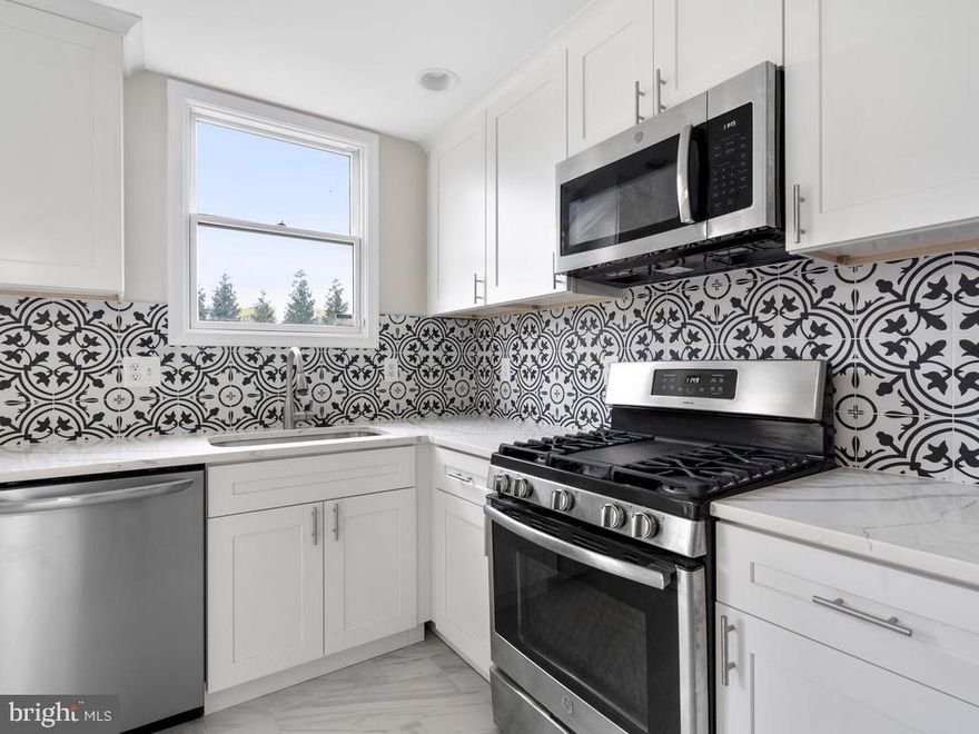 New rehab in Spicer's Run. Come see this modern Bolton Hill townhome. This home has been updated with a new kitchen with stainless steel appliances and granite. Beautiful flooring throughout the home. All baths are new and updated. High end upgrades are everywhere including custom backsplashes and sliding barn doors. A fully finished basement with an extra bedroom and fire place in the family room. Rear deck is being built!!