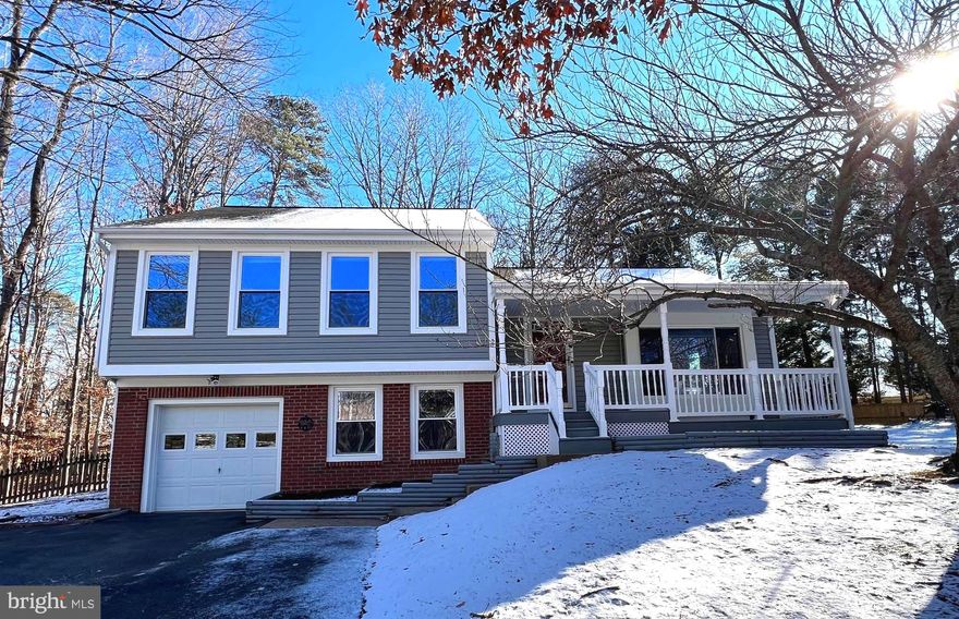 This four-level garaged home, located on a private half-acre, cul-de-sac lot, has been beautifully updated. The home features a stunning, renovated gourmet kitchen, hardwood floors, a huge primary bedroom with an updated primary bathroom, dual closets, a family room/recreation room or spacious office, and an abundance of storage space. Outdoor living includes an inviting front porch, an expansive deck and patio, and a fenced, level backyard with plenty of usable open space and trees for privacy. Other recent updates include all new plumbing (2023), HVAC (2017), and water heater (2023). The basement has a rough-in ready for a 3rd full bathroom. Conveniently located just minutes to fantastic shopping and restaurants on Rt 610 Grarrisonville Rd, schools, commuter lots, VRE, and I-95 Express Lanes.